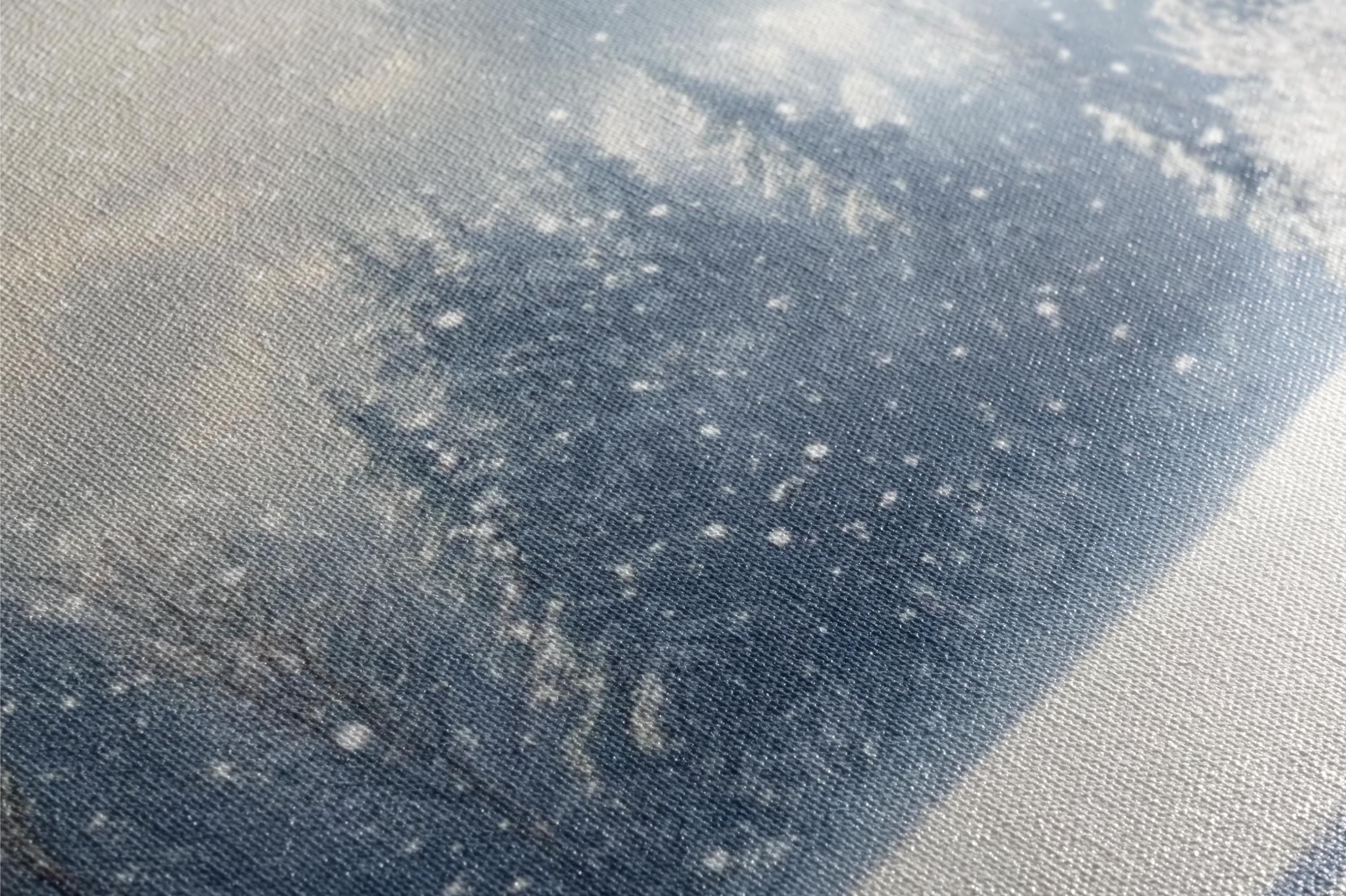 a close up of a piece of cloth with snow on it