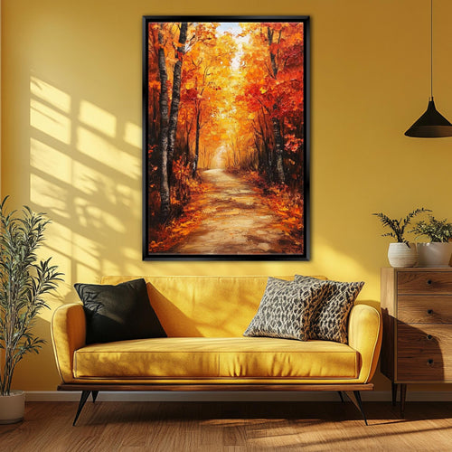 a large painting of a forest path with autumn foliage hanging on a yellow wall above a yellow couch with black and leopard print pillows.
