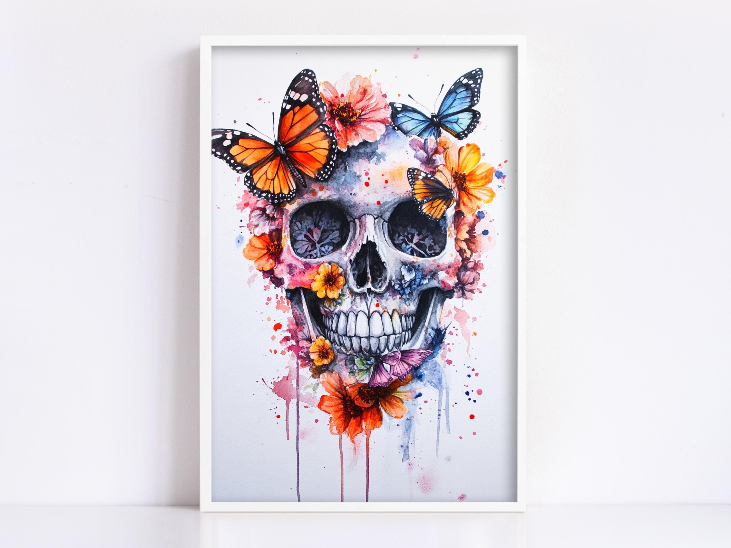 A framed artwork depicting a colorful and intricate skull design surrounded by butterflies and flowers.