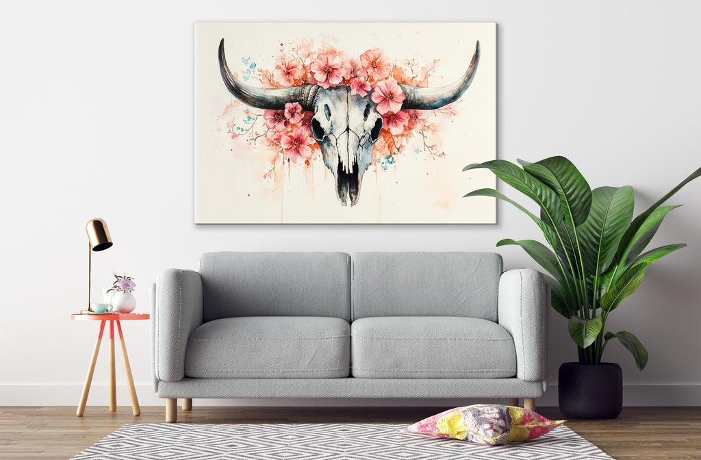 a gray sofa, a potted plant, a lamp, and a large floral skull artwork on the wall.