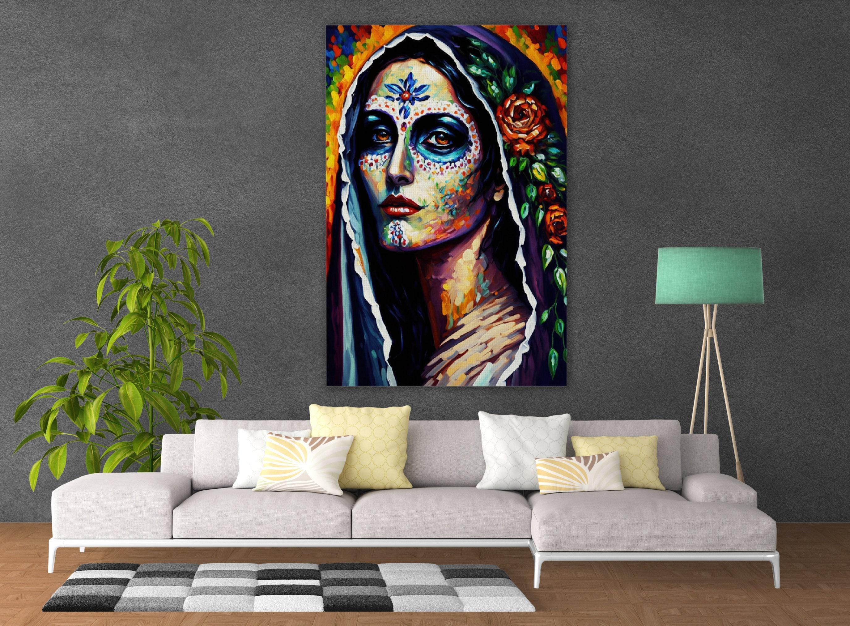 a large, colorful painting of a woman with intricate face paint and floral decorations, hanging on a wall above a white sofa with decorative pillows.