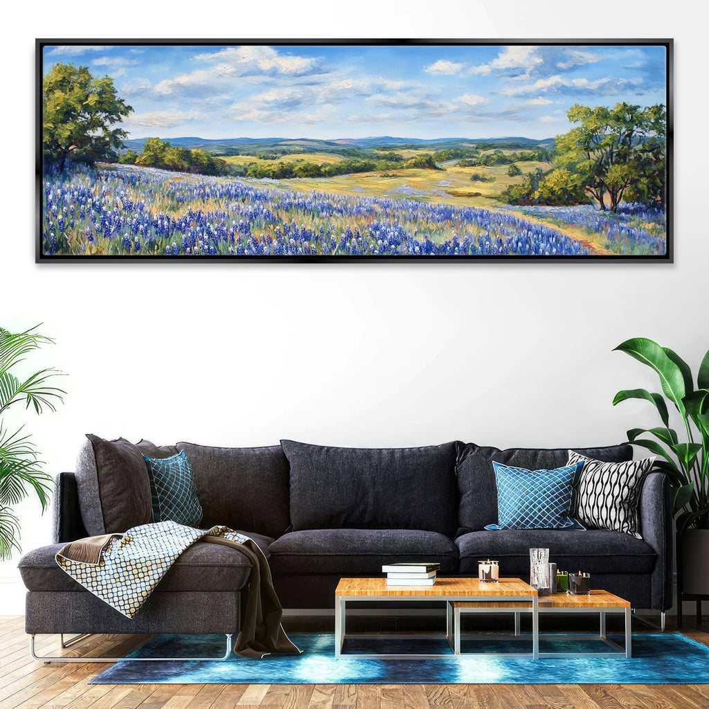a living room with a couch and a painting on the wall