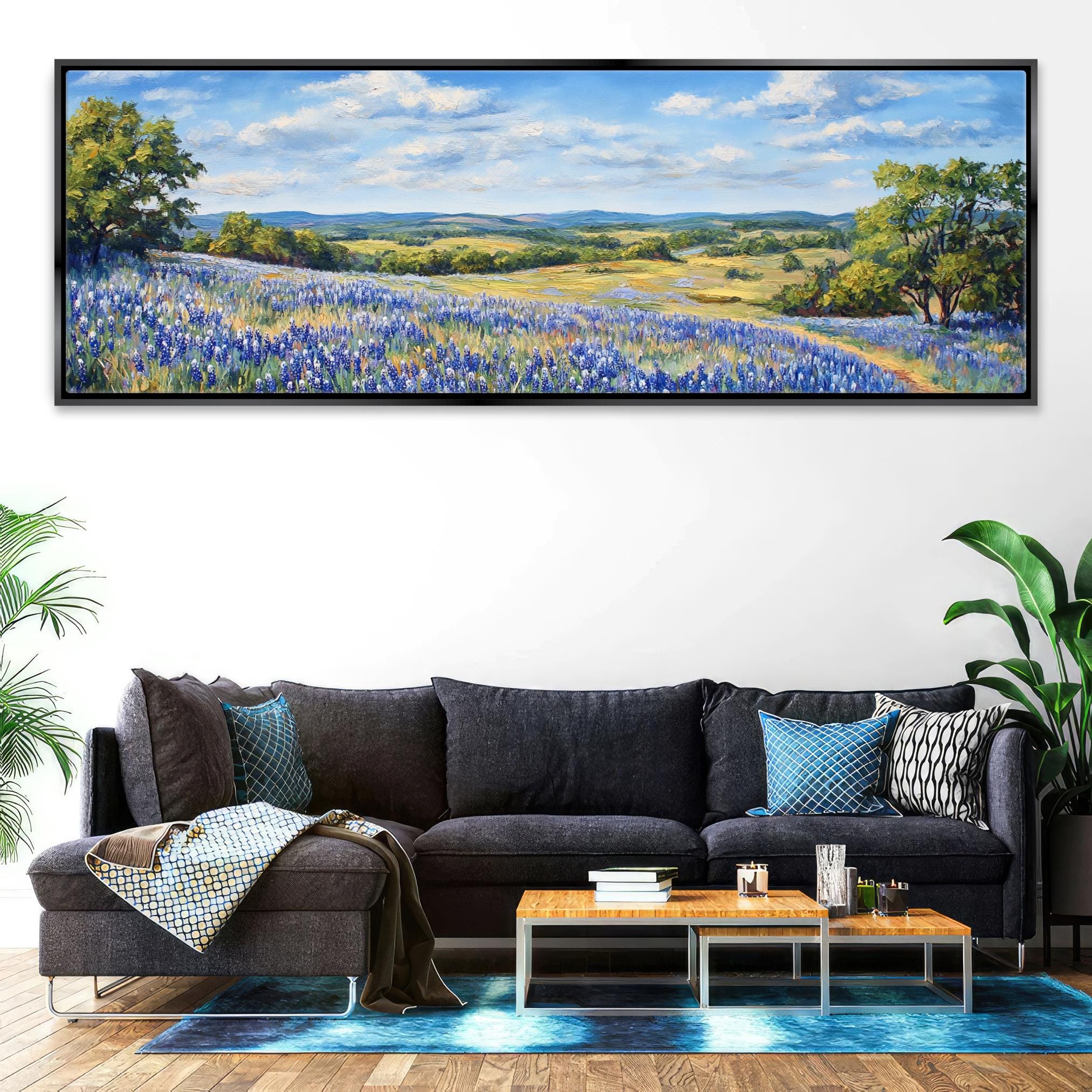 a living room with a couch and a painting on the wall