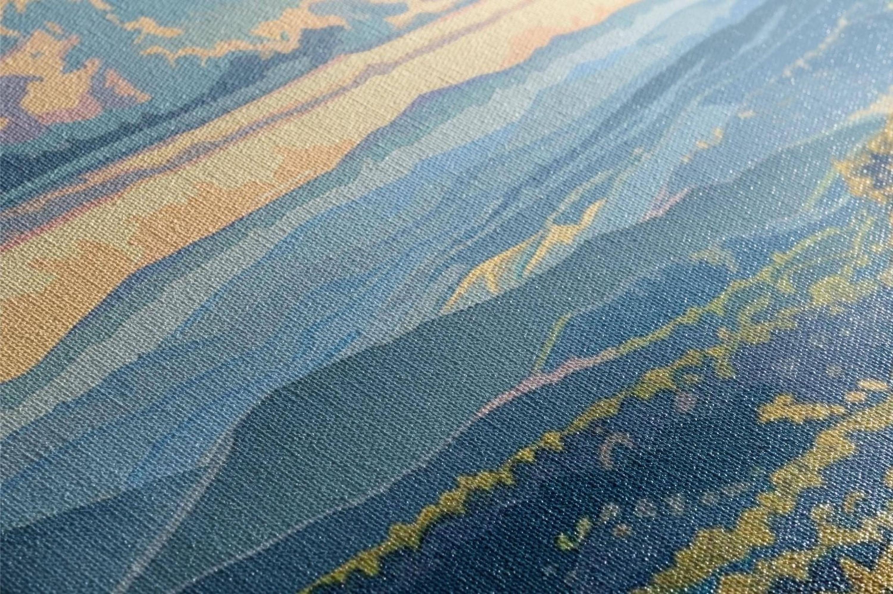 a close up of a blue and yellow area rug