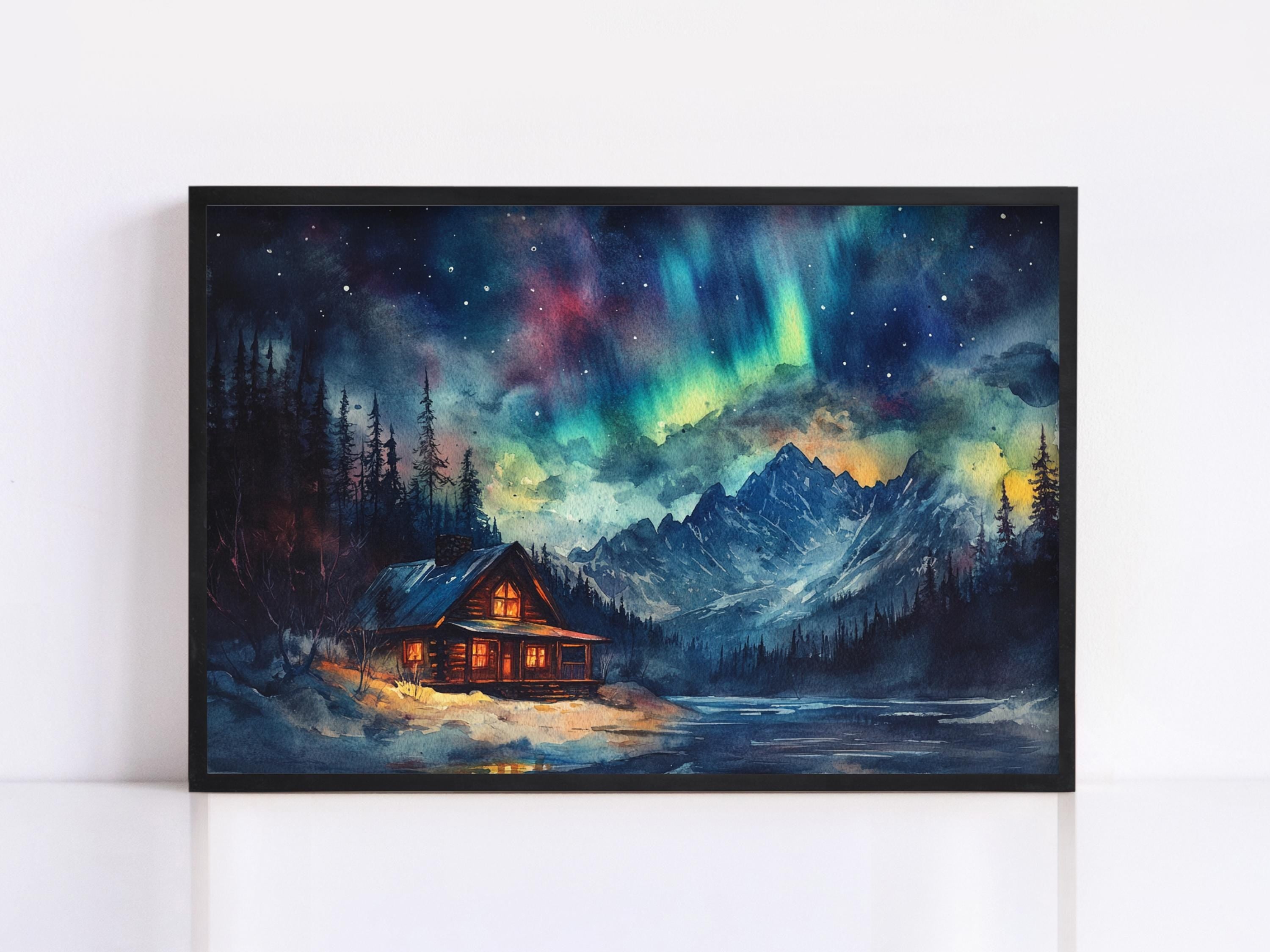 A framed painting depicting a cabin nestled in a snowy mountain landscape, with a starry night sky and a vibrant display of the northern lights above.