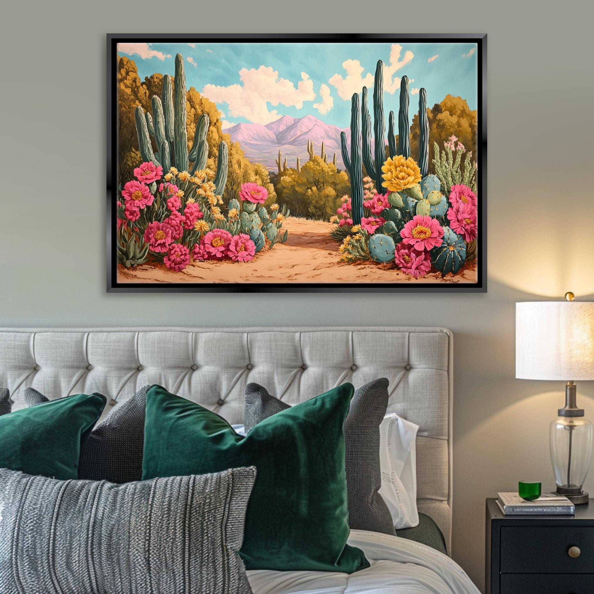 a painting of a desert scene on a wall above a bed