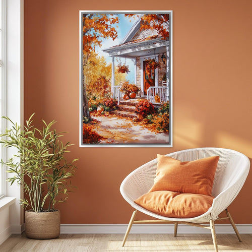 a cozy living room with a large painting of a house and autumn foliage hanging on the wall. The painting depicts a porch with a white railing and a white door, surrounded by a variety of colorful fall foliage. The room is decorated with a white wicker chair and a potted plant, creating a warm and inviting atmosphere.