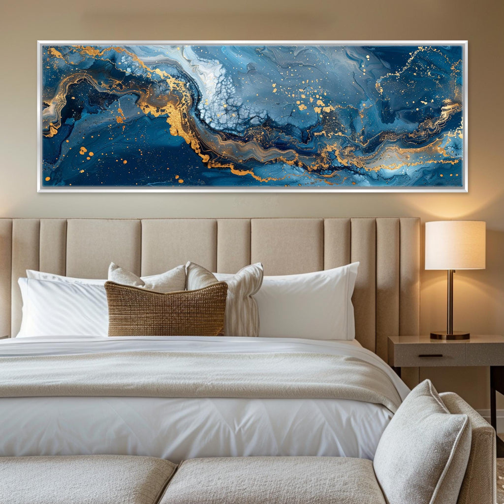 a bedroom with a large painting on the wall above the bed