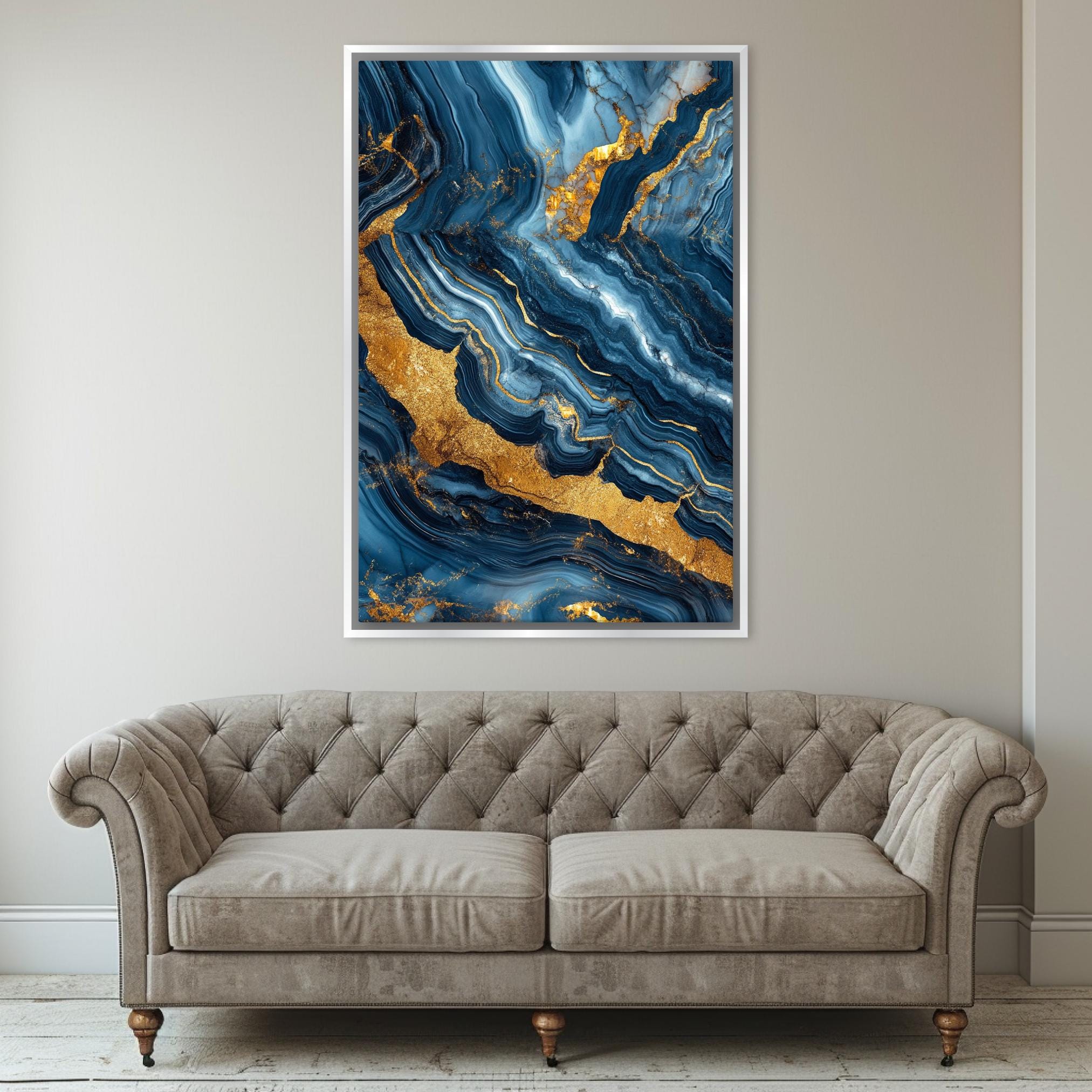 a living room with a couch and a painting on the wall