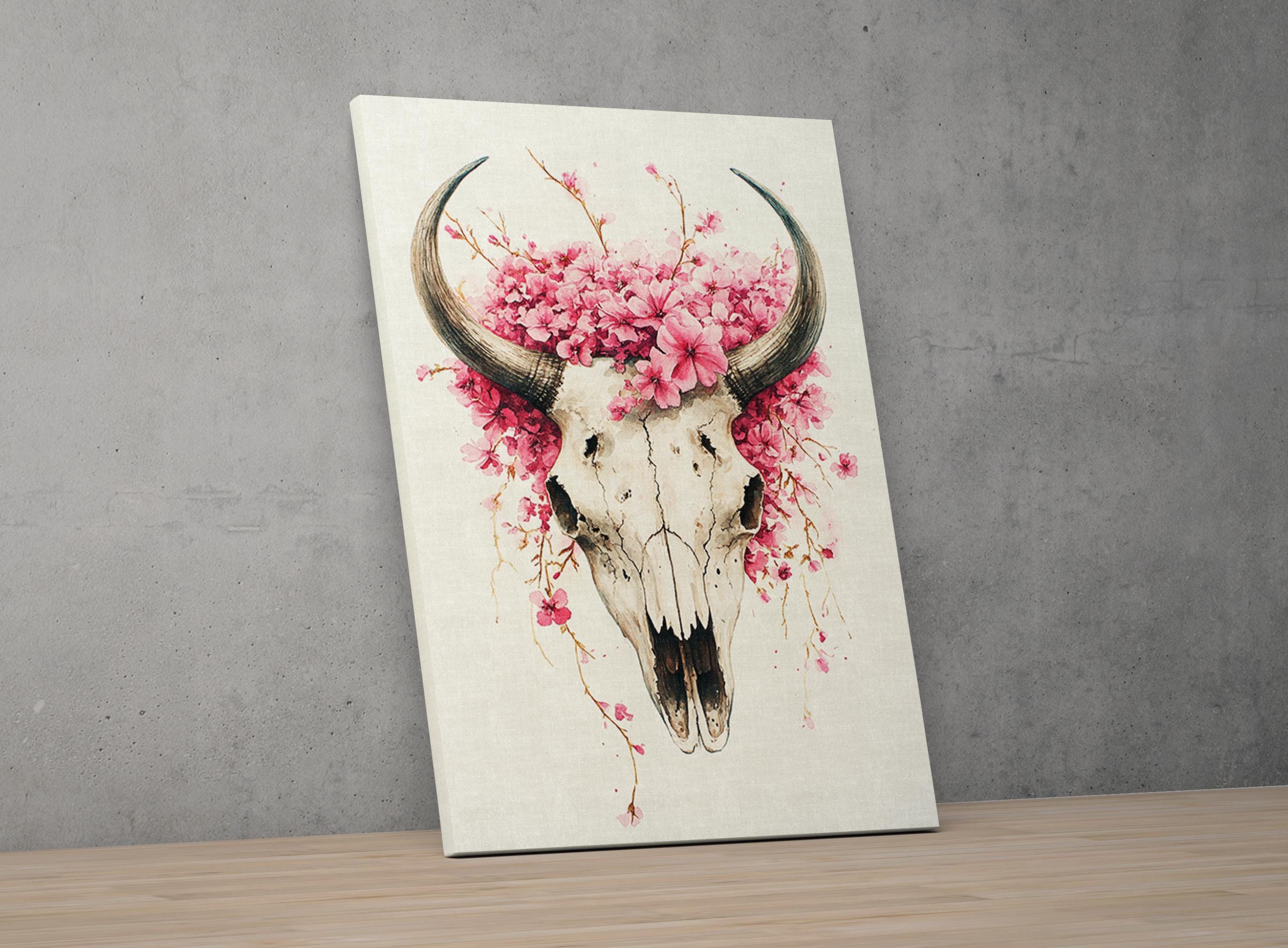 a skull with large horns, adorned with pink flowers and branches, creating a striking and artistic composition.