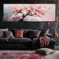 a living room with a couch and a painting on the wall