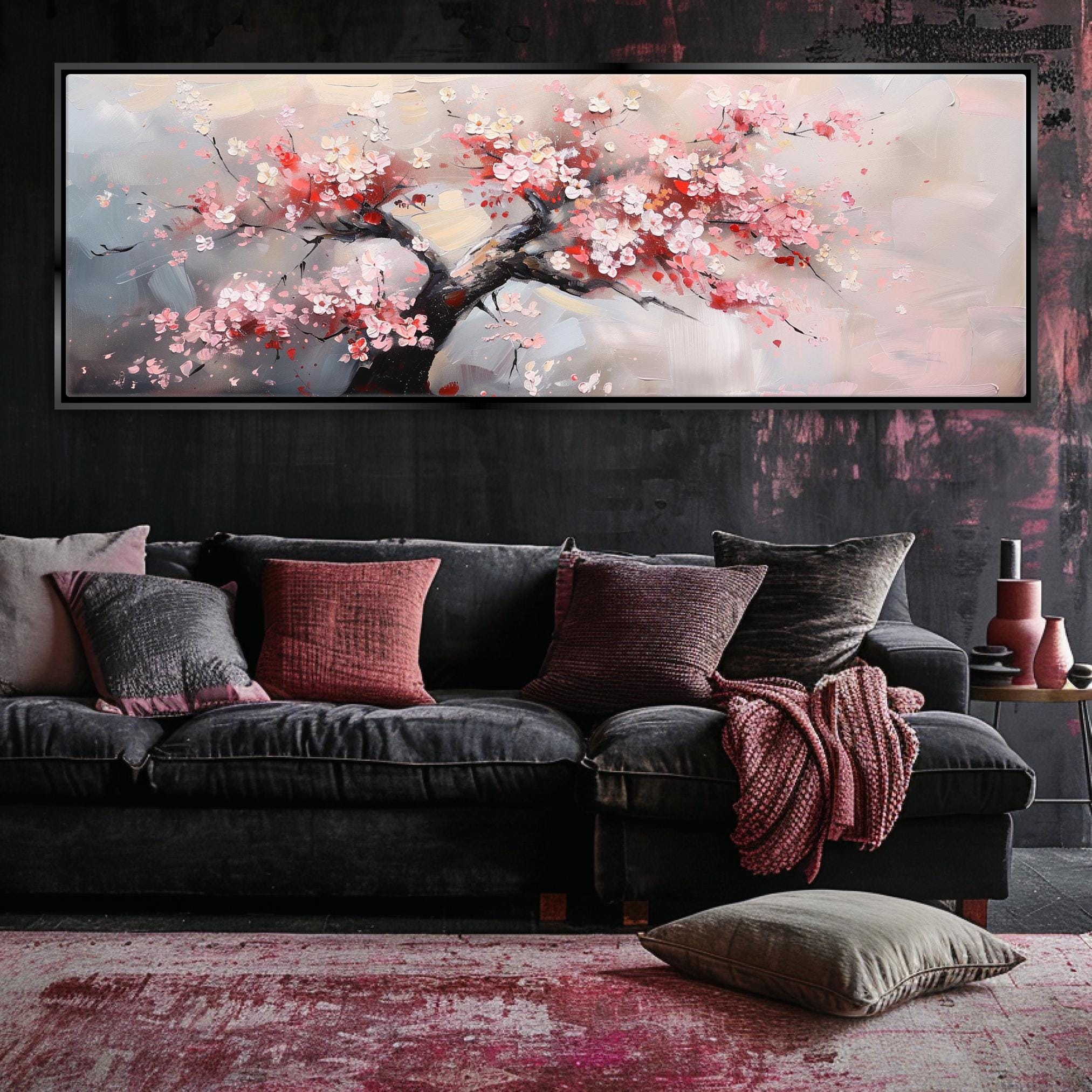 a living room with a couch and a painting on the wall