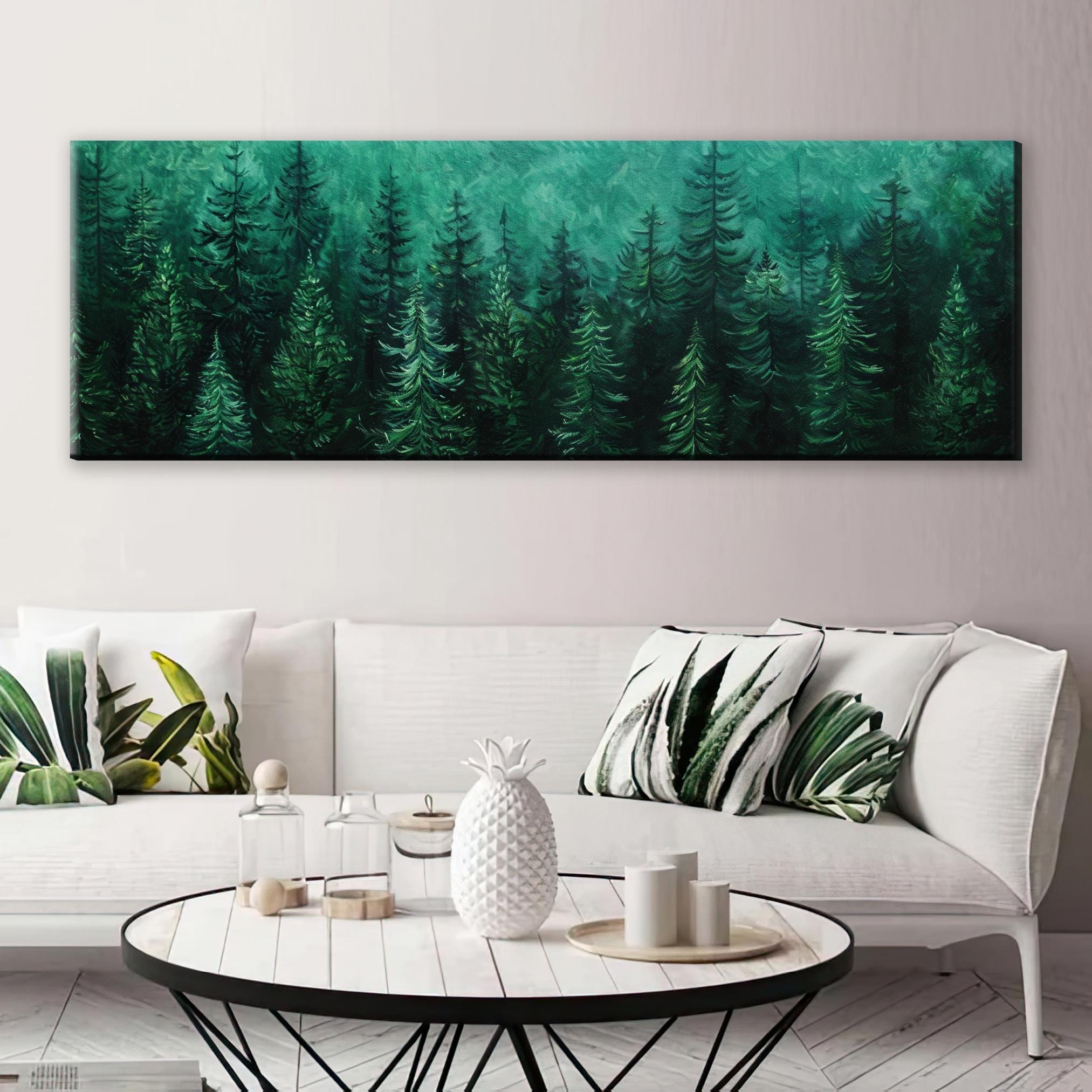 a living room with a white couch and a painting on the wall