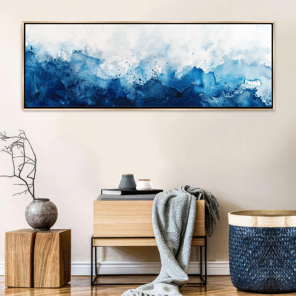 a painting hanging on a wall above a table