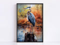 A blue heron standing on a rock in a pond, surrounded by autumn foliage.
