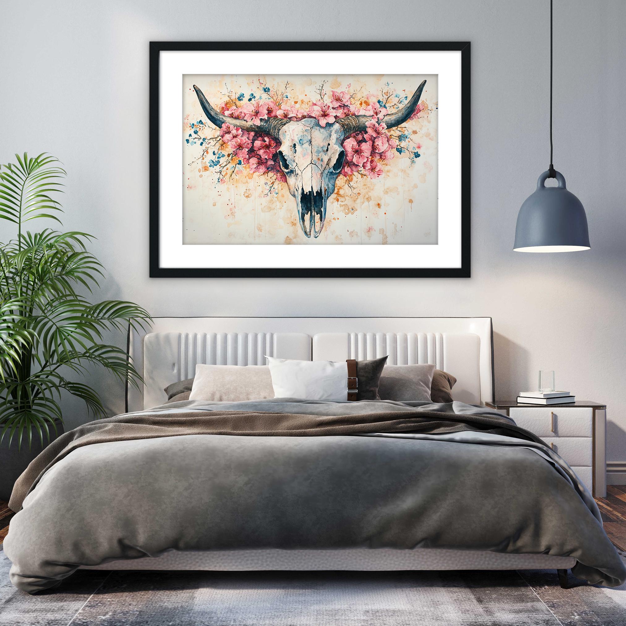 a bedroom with a large bed, a framed artwork of a skull with flowers hanging above it, and a potted plant to the left.