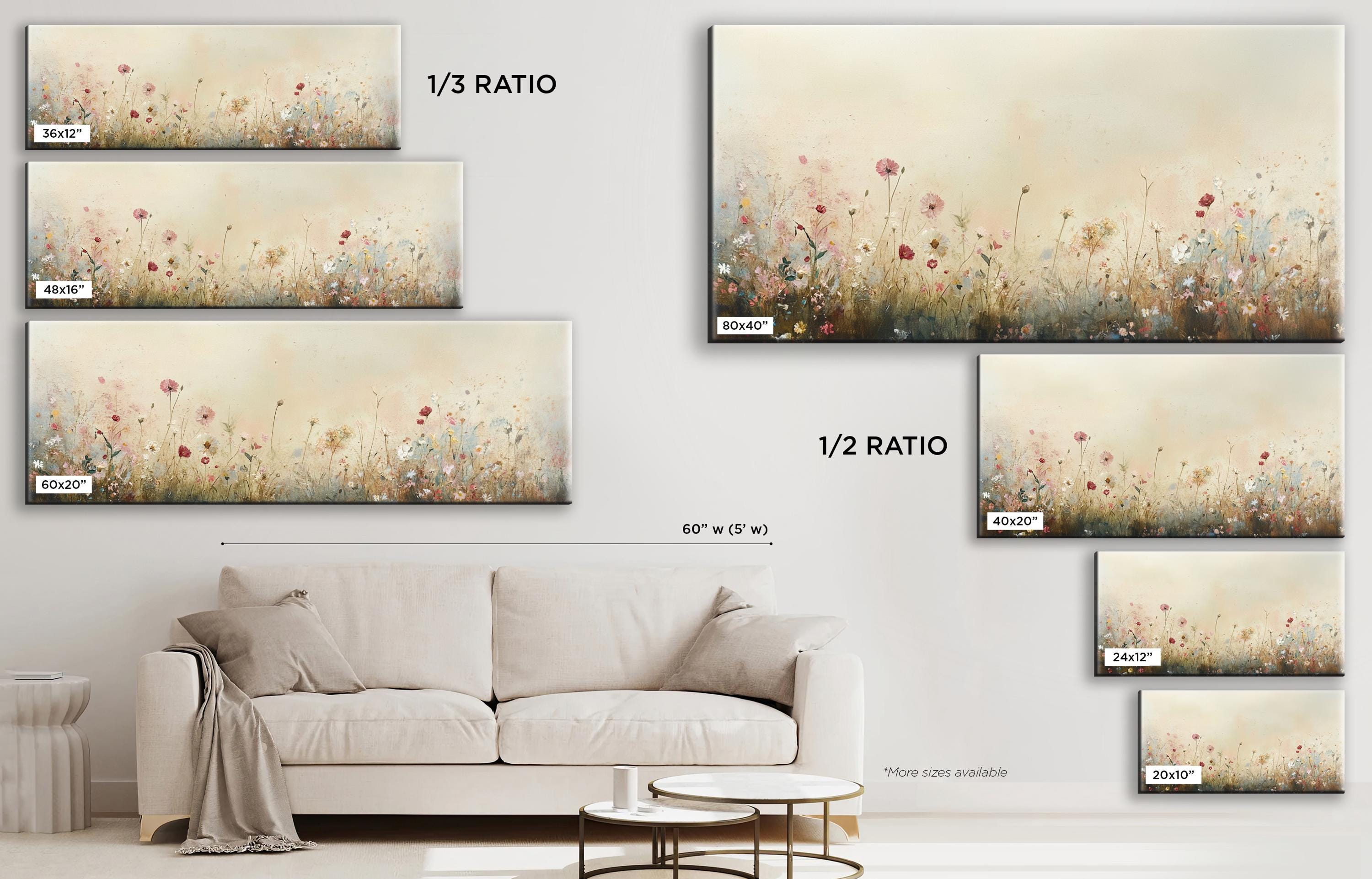 a living room with a couch and paintings on the wall