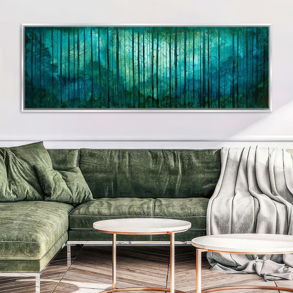 a living room with a green couch and a painting on the wall