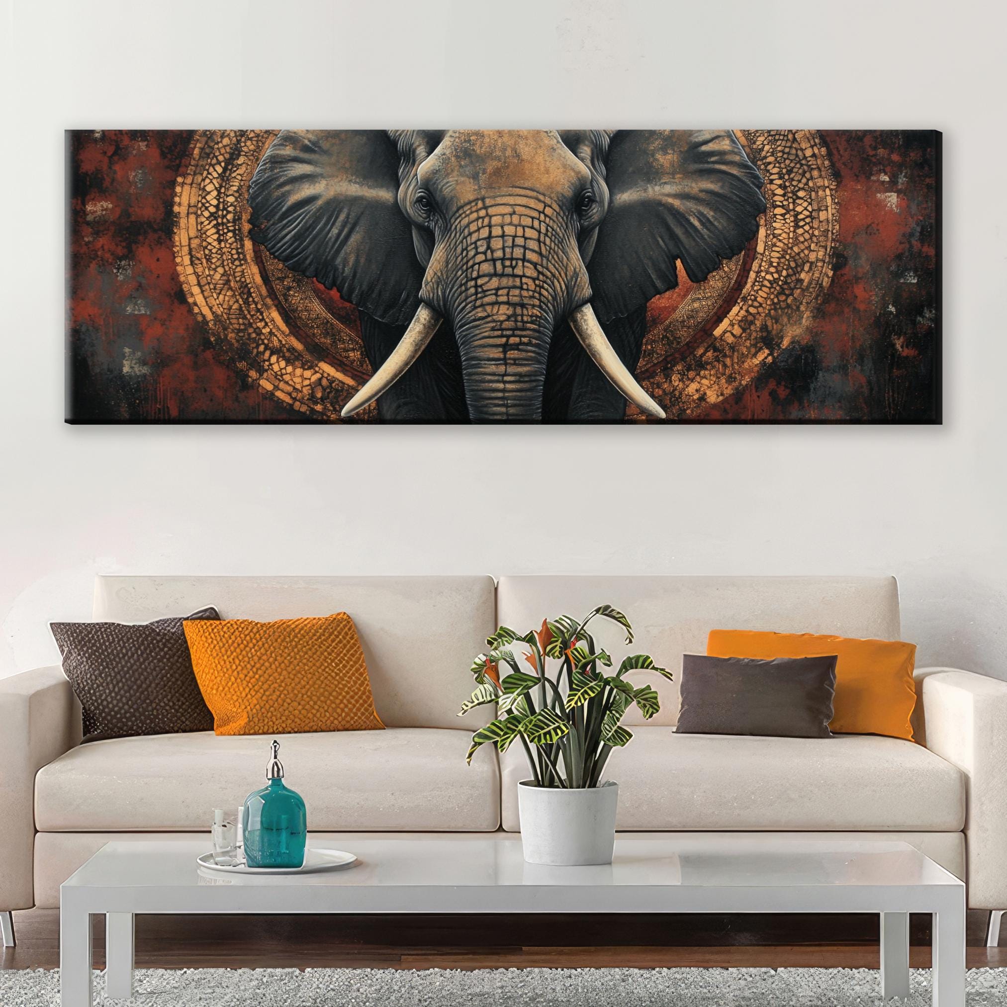 a painting of an elephant on a wall above a couch