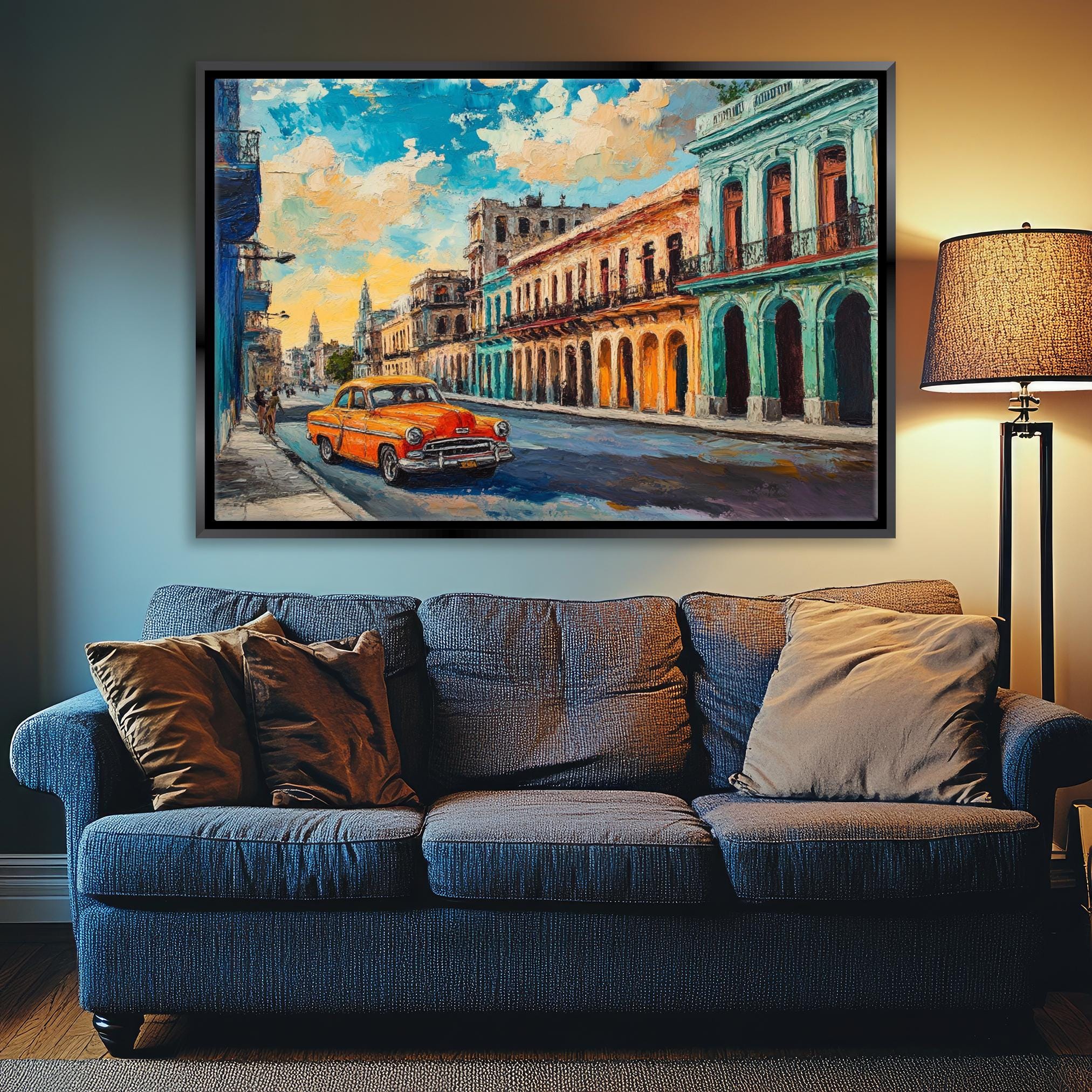 a living room with a couch and a painting on the wall