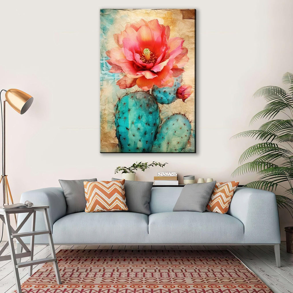 a large, vibrant painting of a cactus flower hanging on a wall above a gray couch with colorful throw pillows.