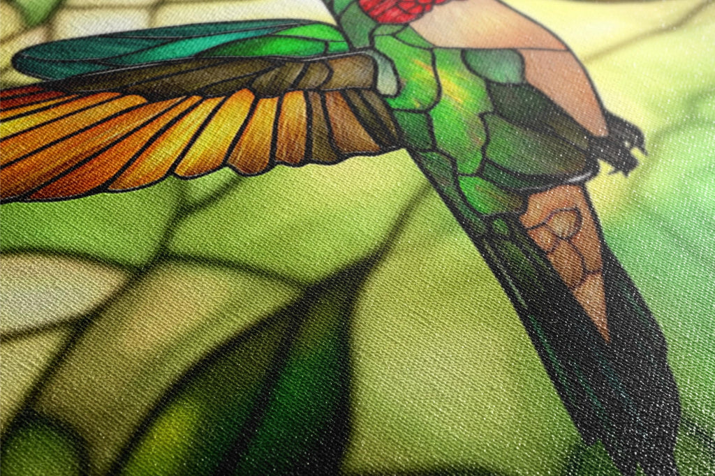 a close up of a stained glass window with a bird on it