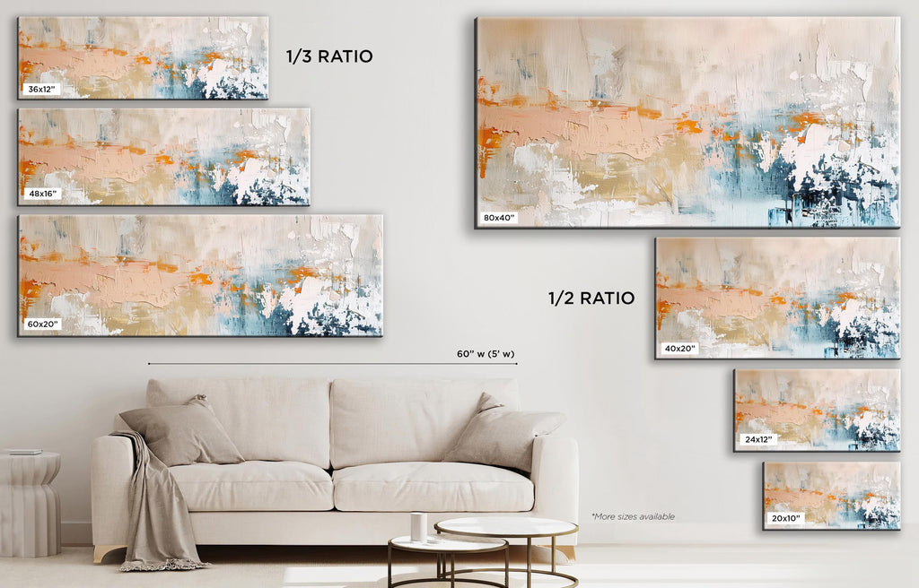 a living room with a white couch and paintings on the wall