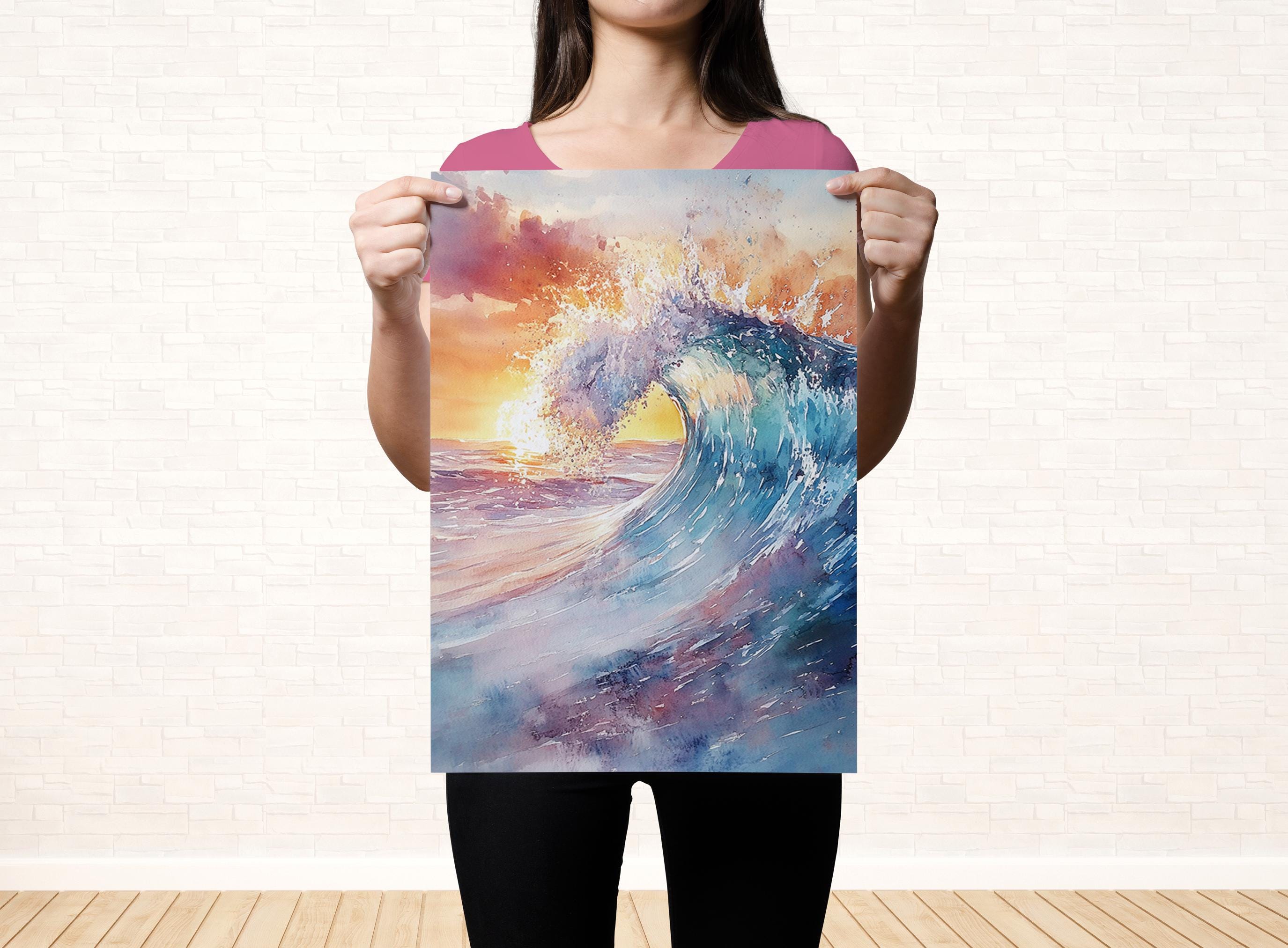 A woman holds up a vibrant watercolor painting depicting a large, crashing wave against a colorful sunset sky.