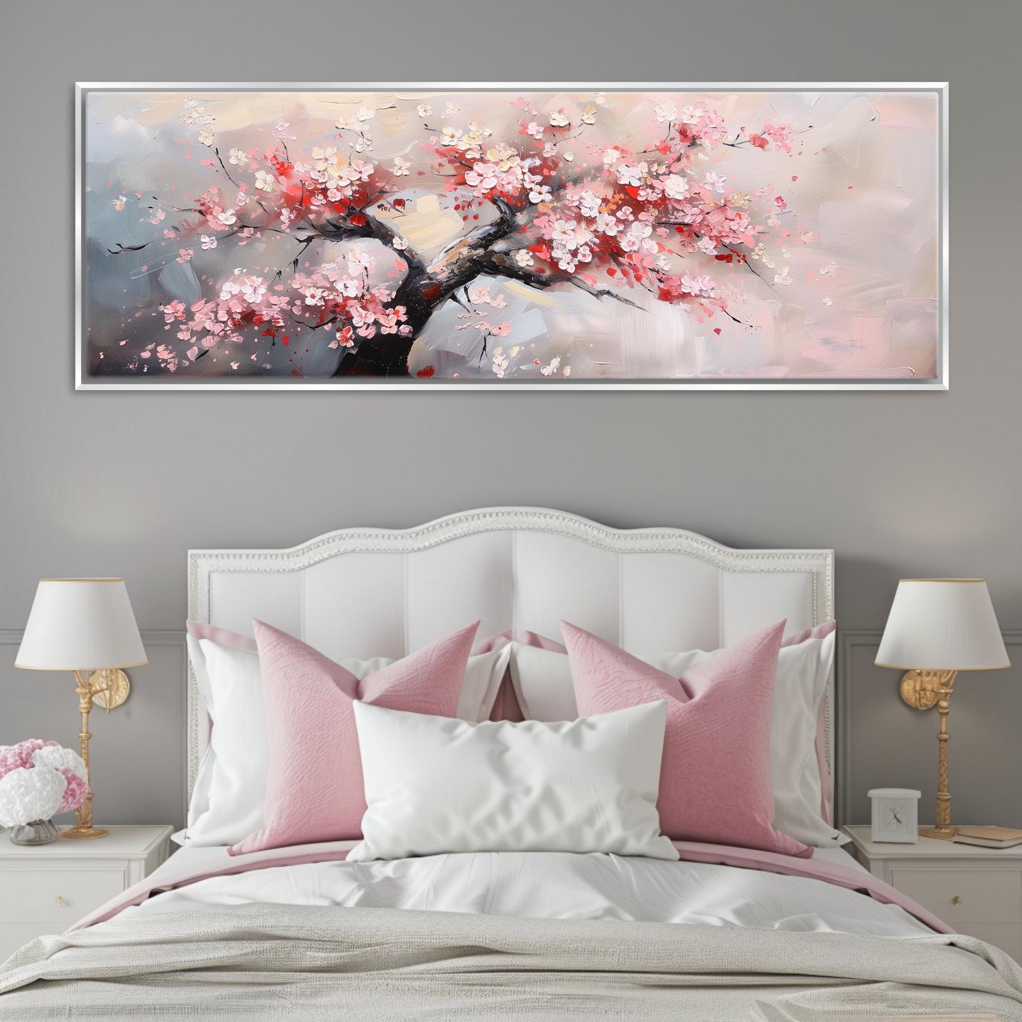a bed with a white headboard and pink pillows