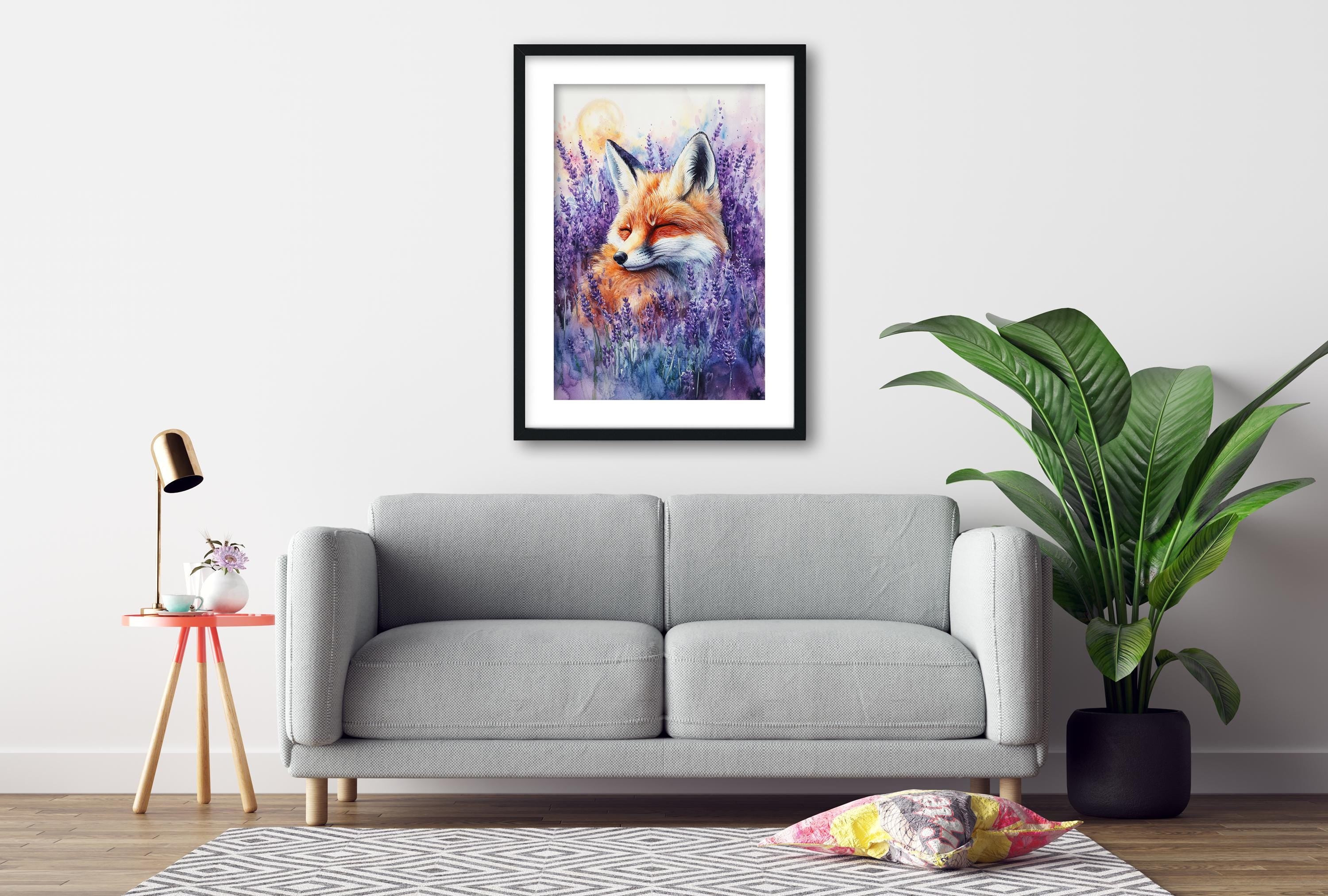 a gray sofa, a framed painting of a fox in a field of purple flowers, a small table with a lamp, and a potted plant.