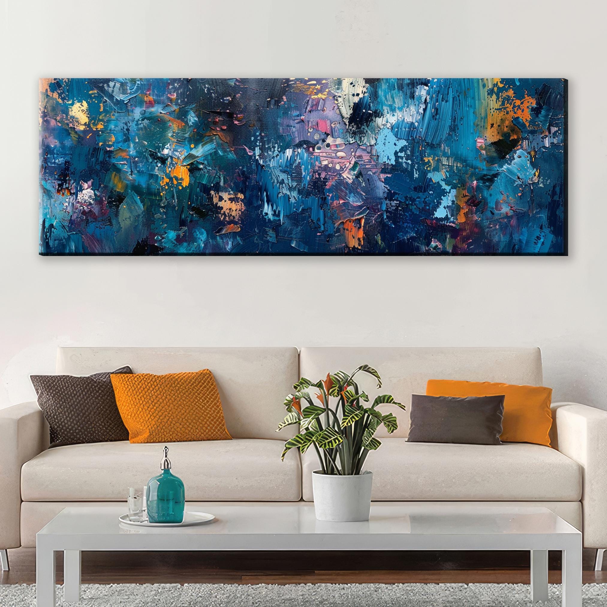 a living room with a couch and a painting on the wall