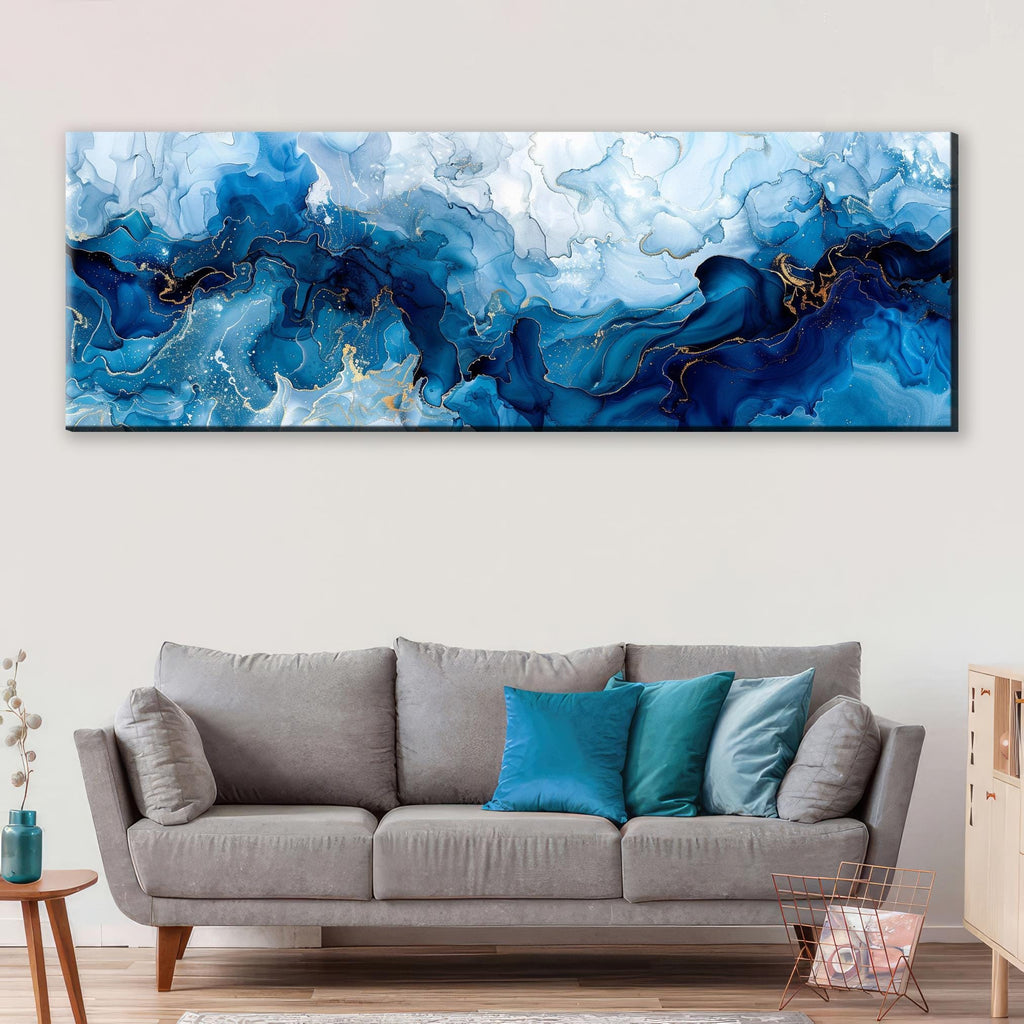a living room with a couch and a painting on the wall
