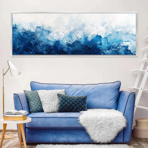 a living room with a blue couch and a painting on the wall