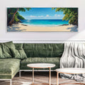 a living room with a green couch and a painting on the wall