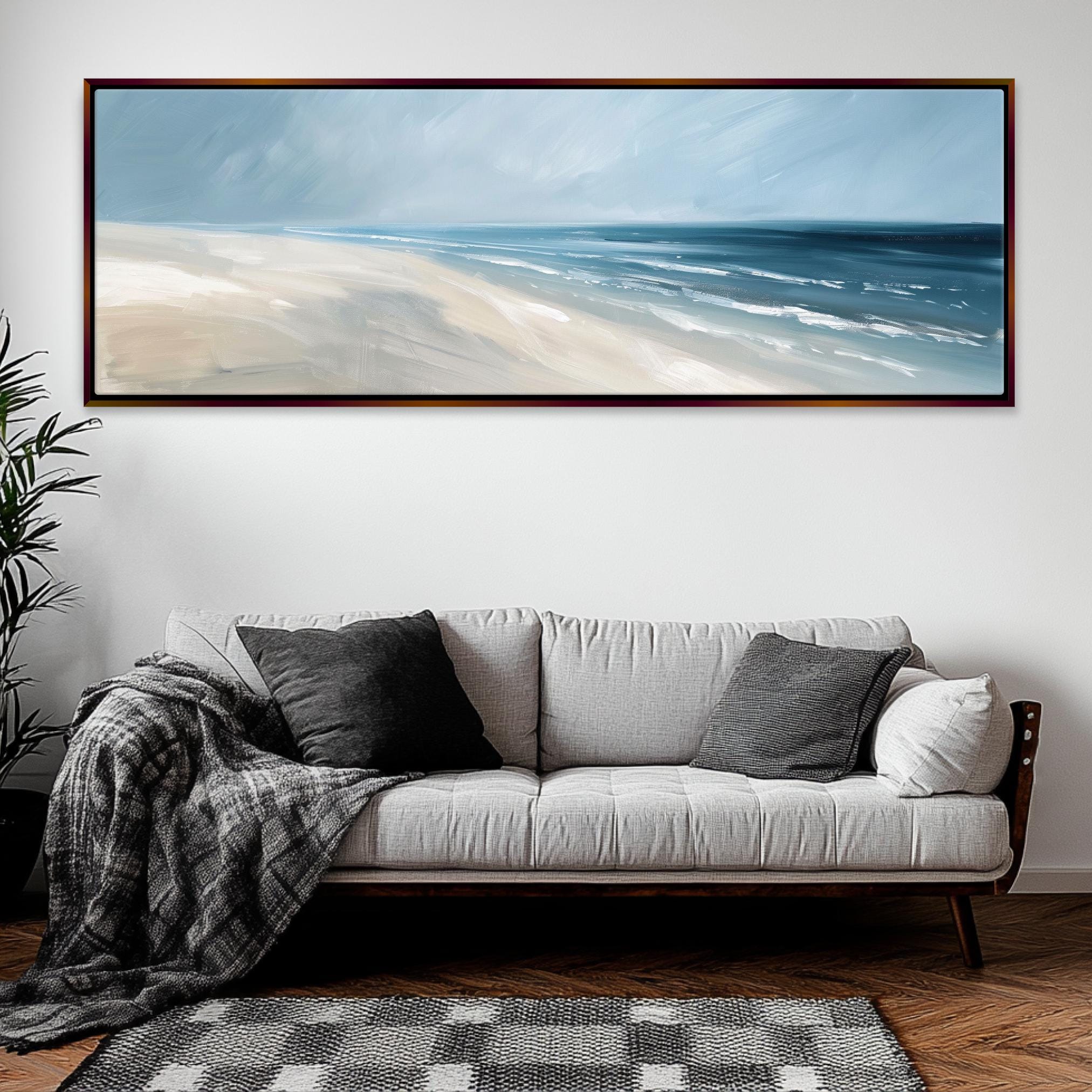 a living room with a couch and a painting on the wall