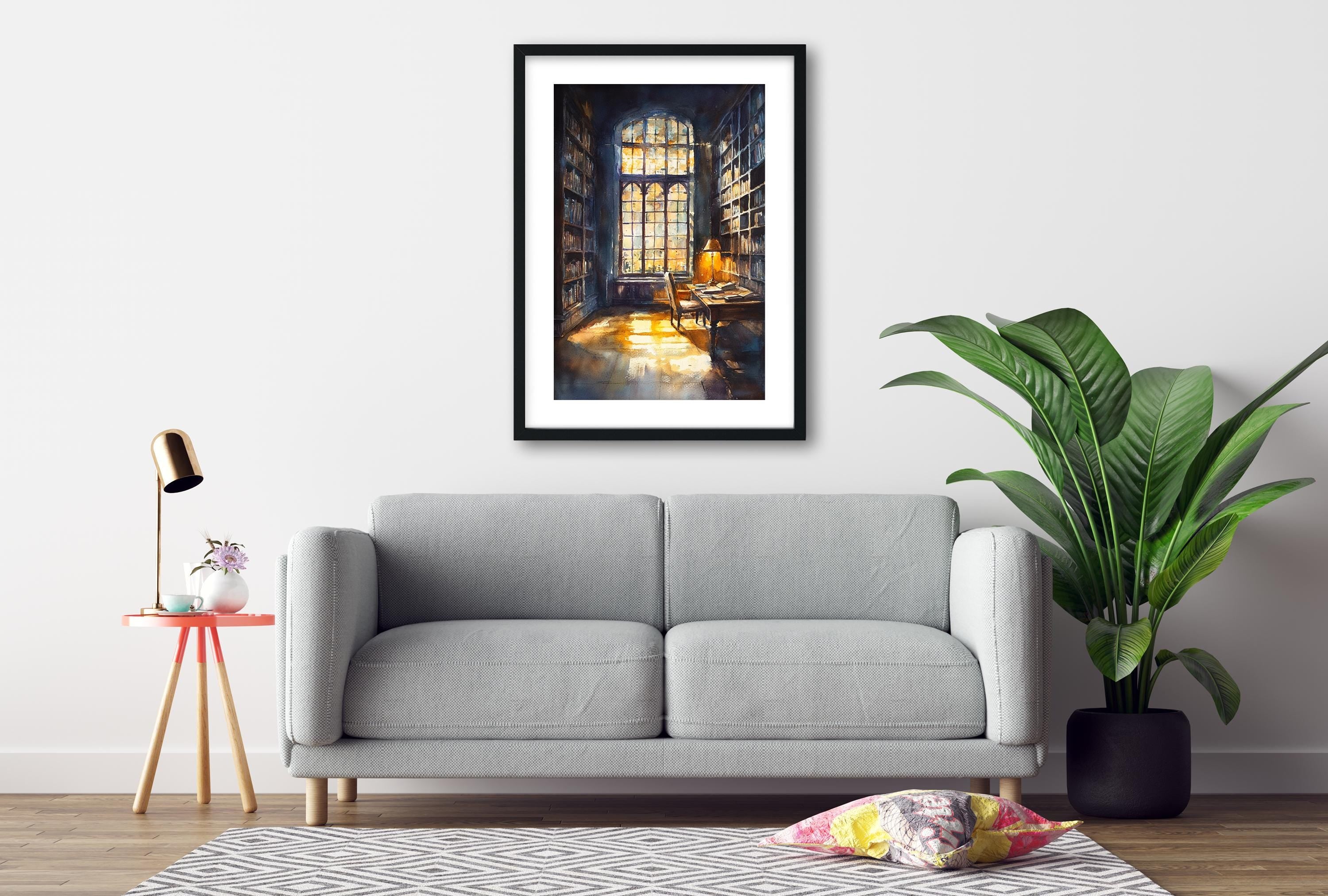 a cozy living room with a gray sofa, a framed painting of a library, a small table with a lamp, and a potted plant.