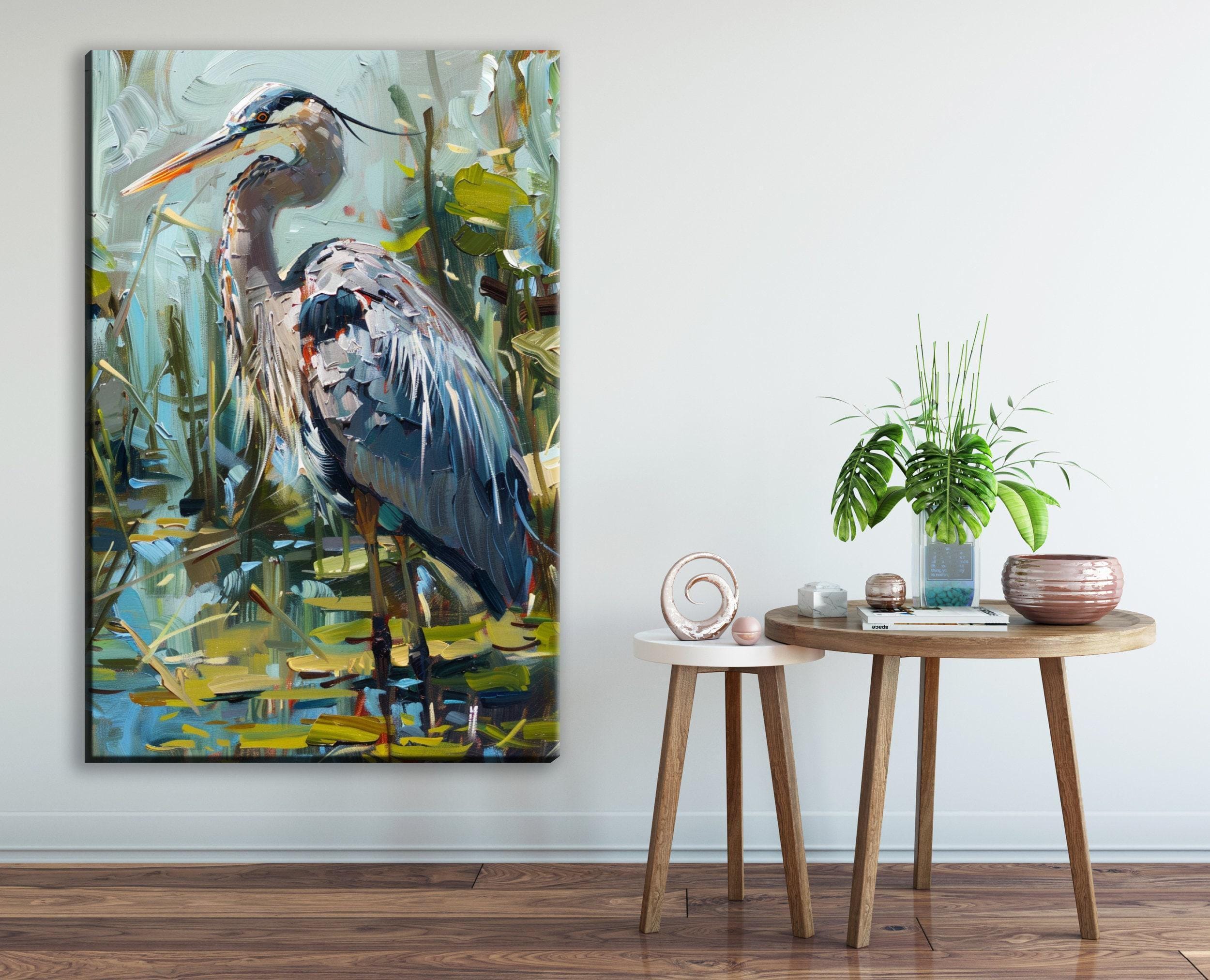 a large painting of a heron standing in a pond, with a wooden table and a potted plant in the foreground.