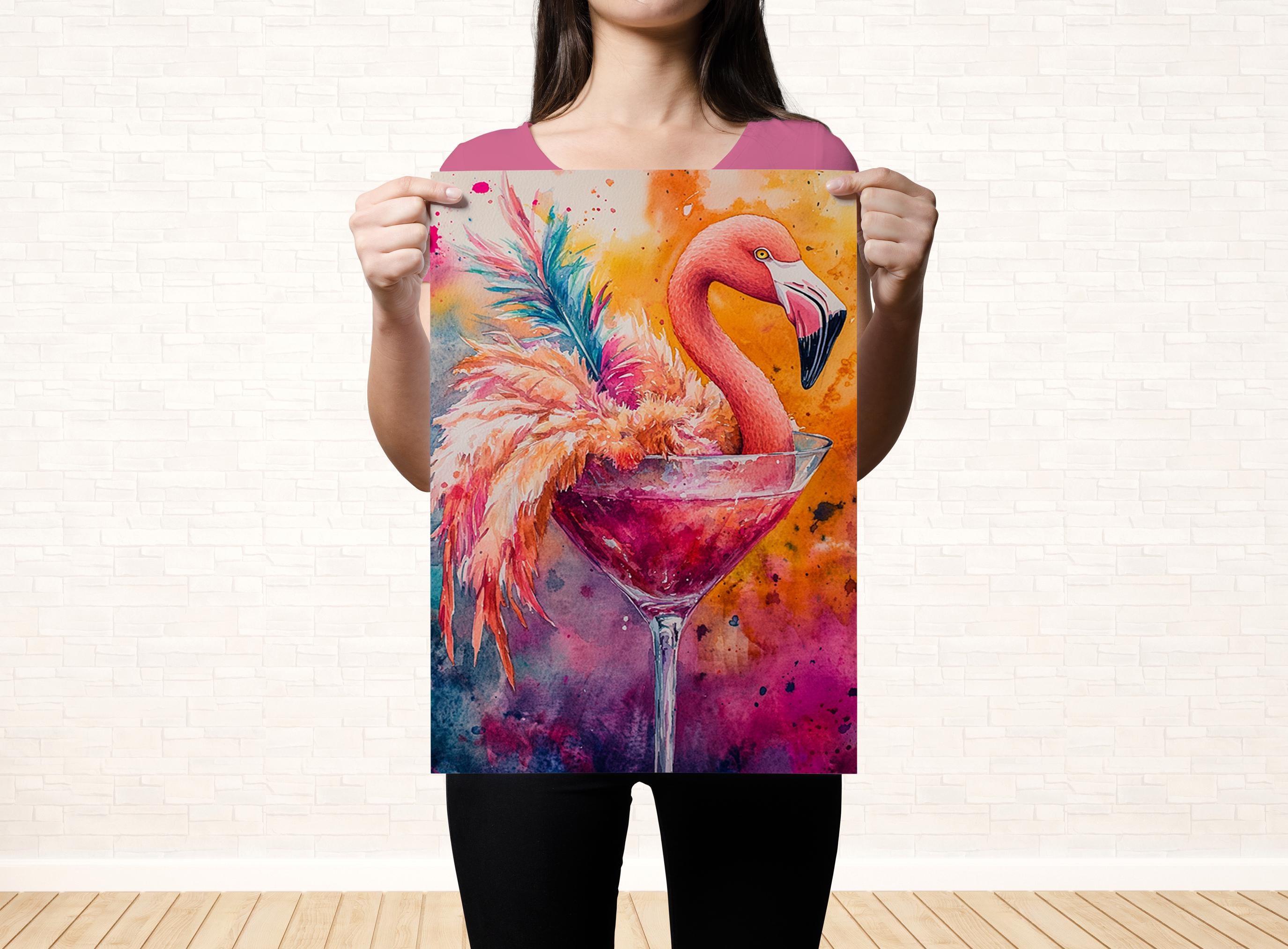 A woman holds up a vibrant painting of a flamingo in a martini glass against a colorful background.