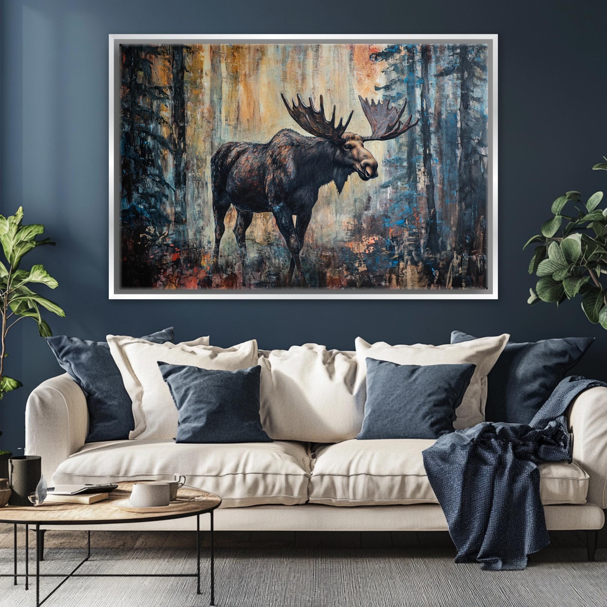 a living room with a couch and a painting of a moose