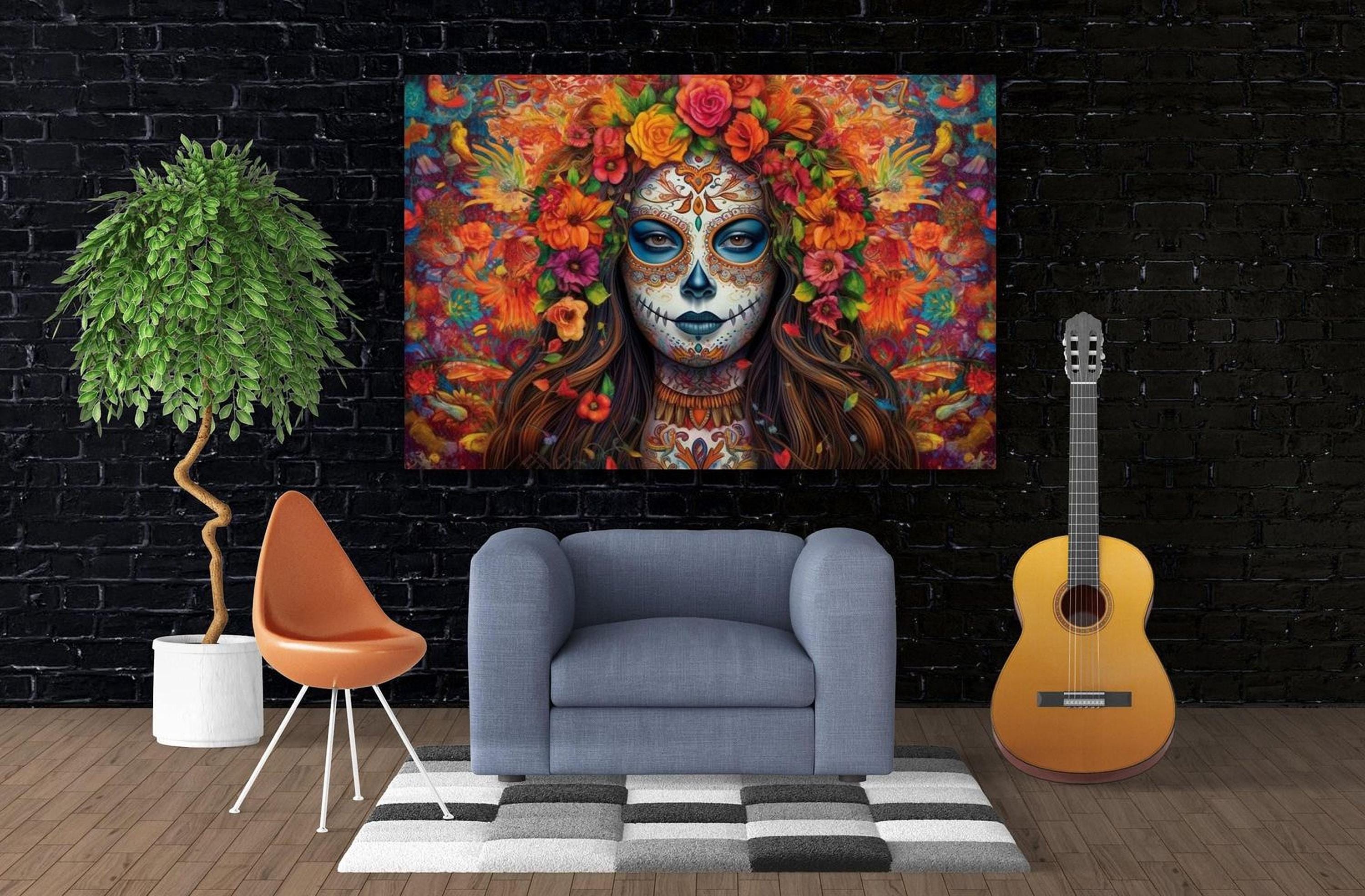 a large, colorful painting of a woman with a skull-like face, surrounded by flowers, hanging on a brick wall. In front of the painting, there is a gray armchair, a potted plant, and a guitar.