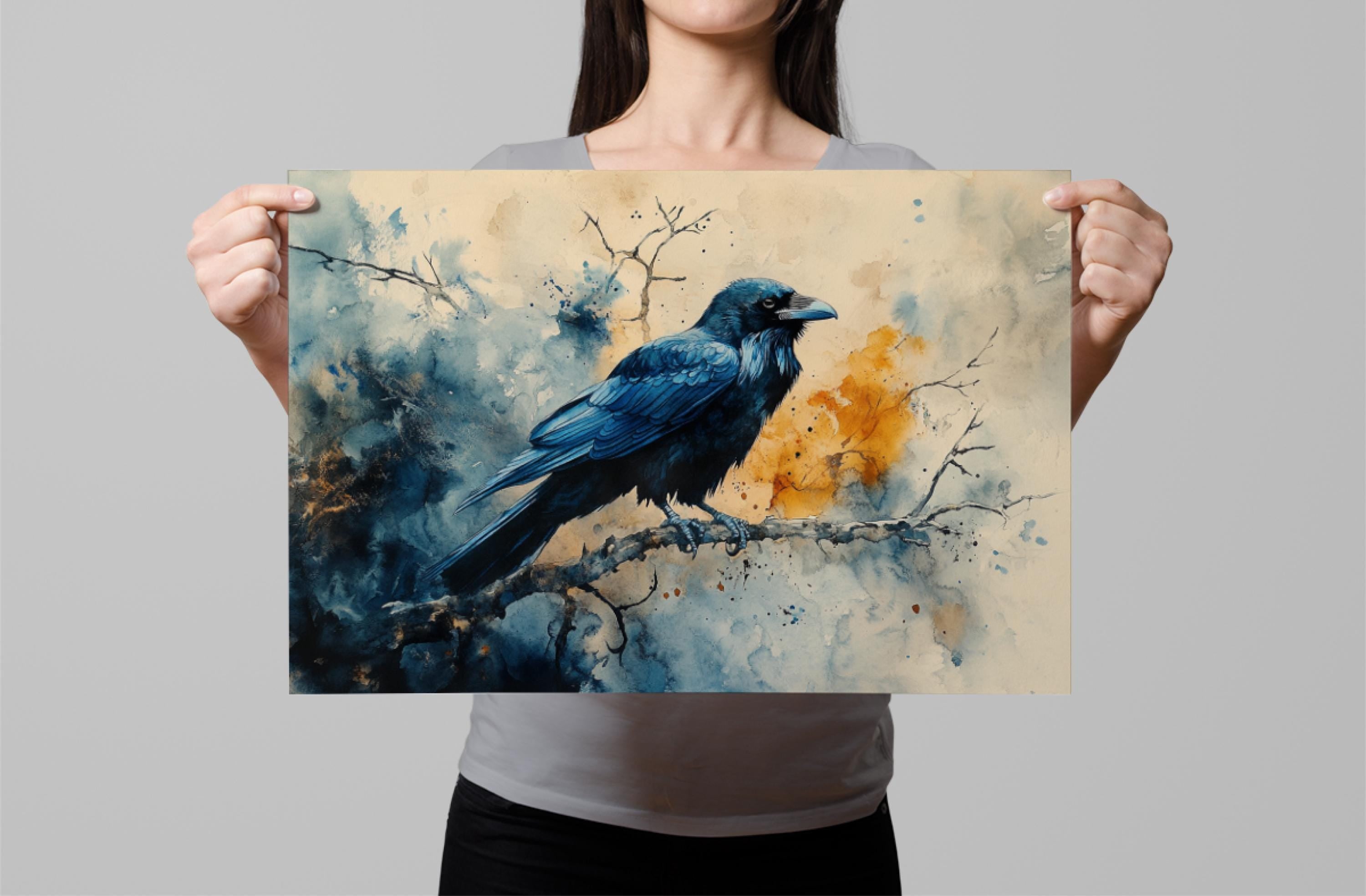 A woman holds up a framed painting of a blue bird perched on a branch.