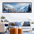 a living room with a couch and a painting on the wall