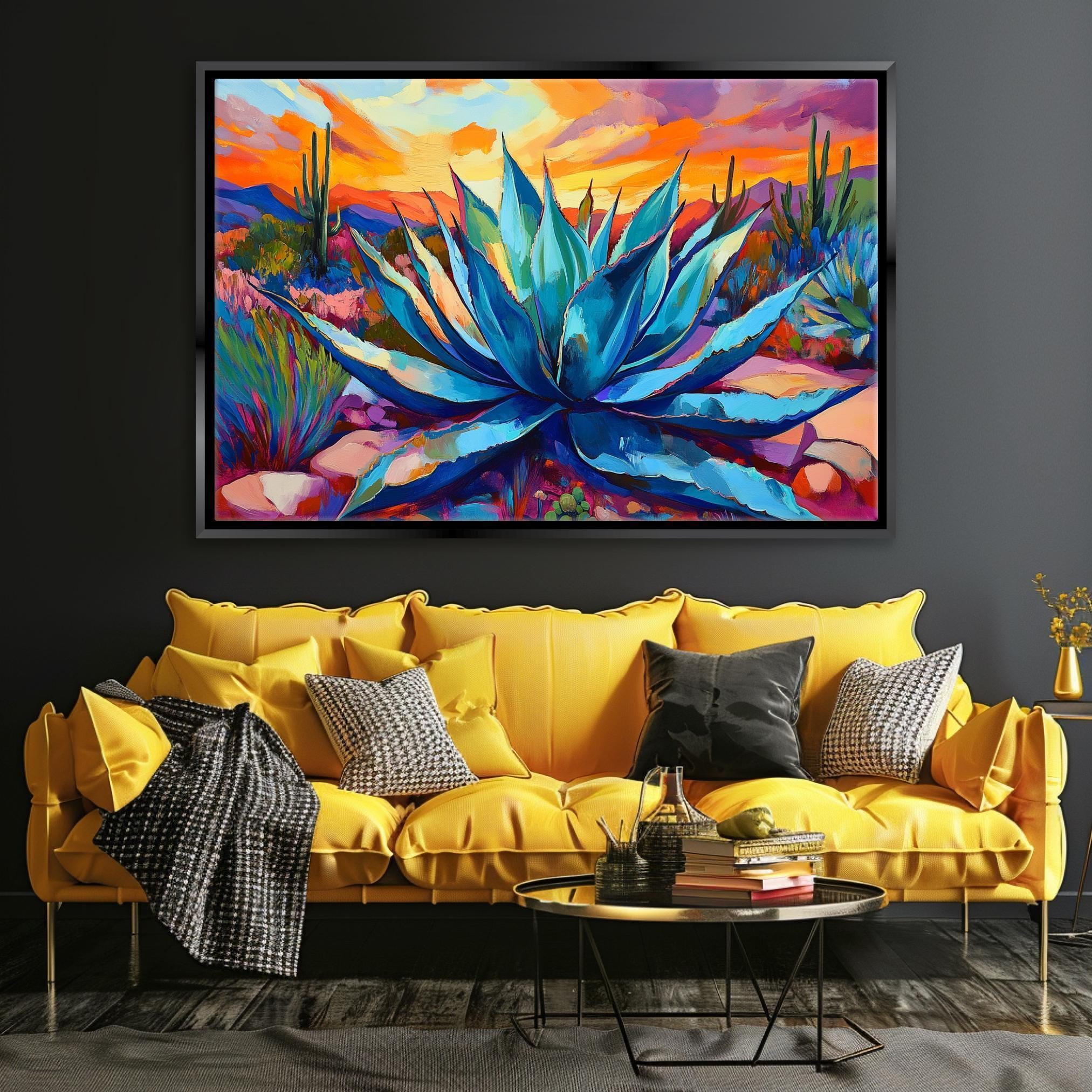a large, vibrant painting of a blue agave plant hanging on a wall above a yellow sofa with multiple pillows.