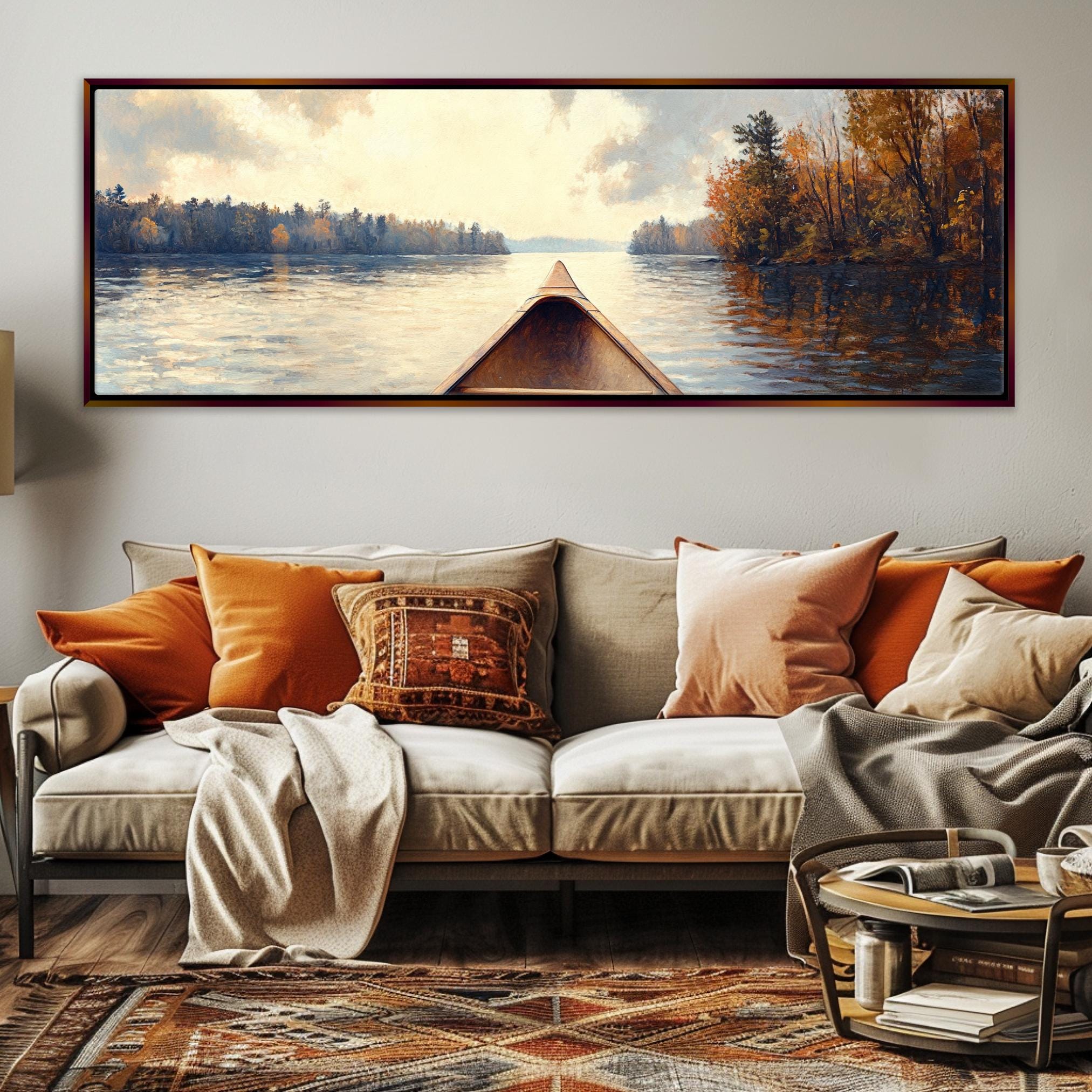 a living room with a couch and a painting on the wall
