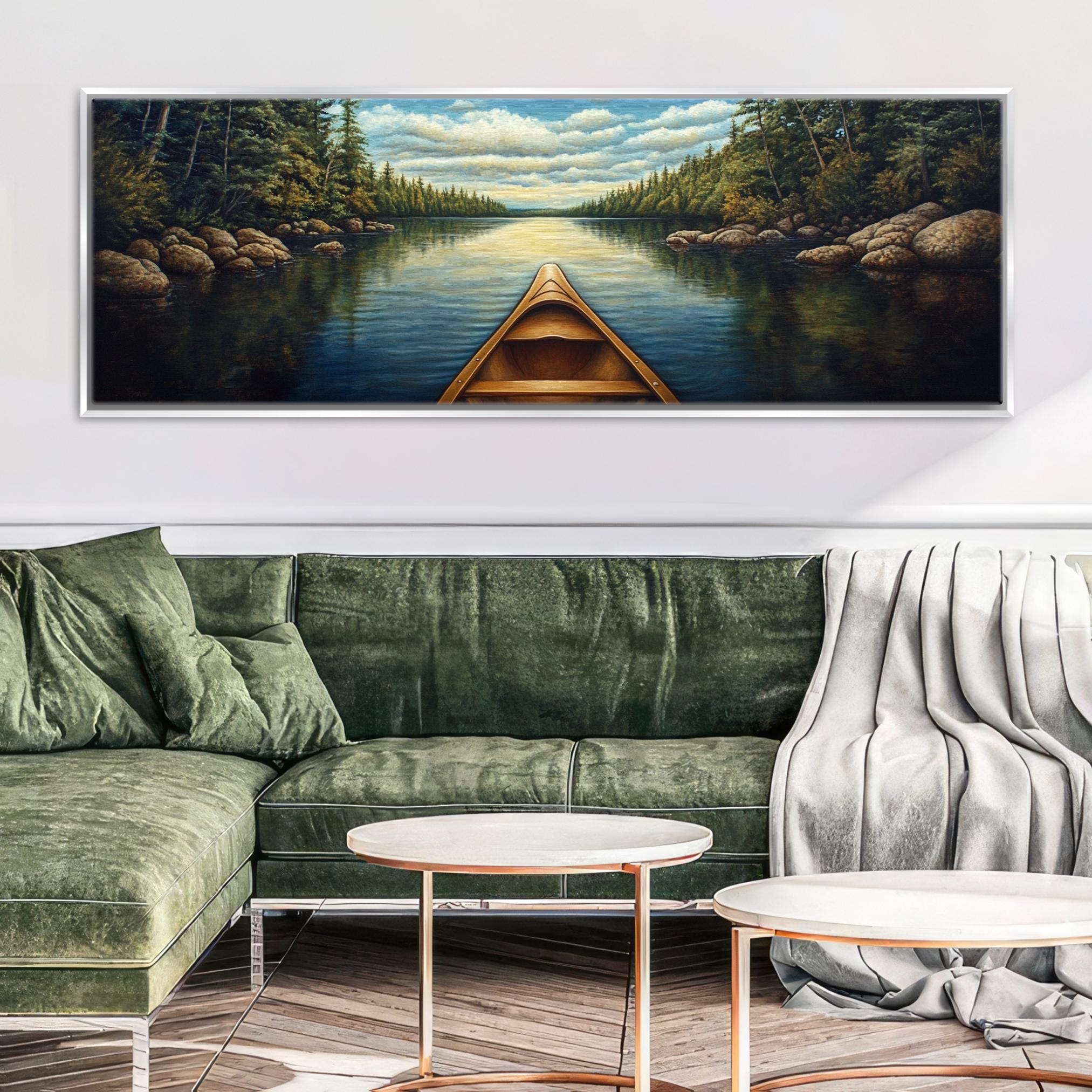 a living room with a green couch and a painting on the wall