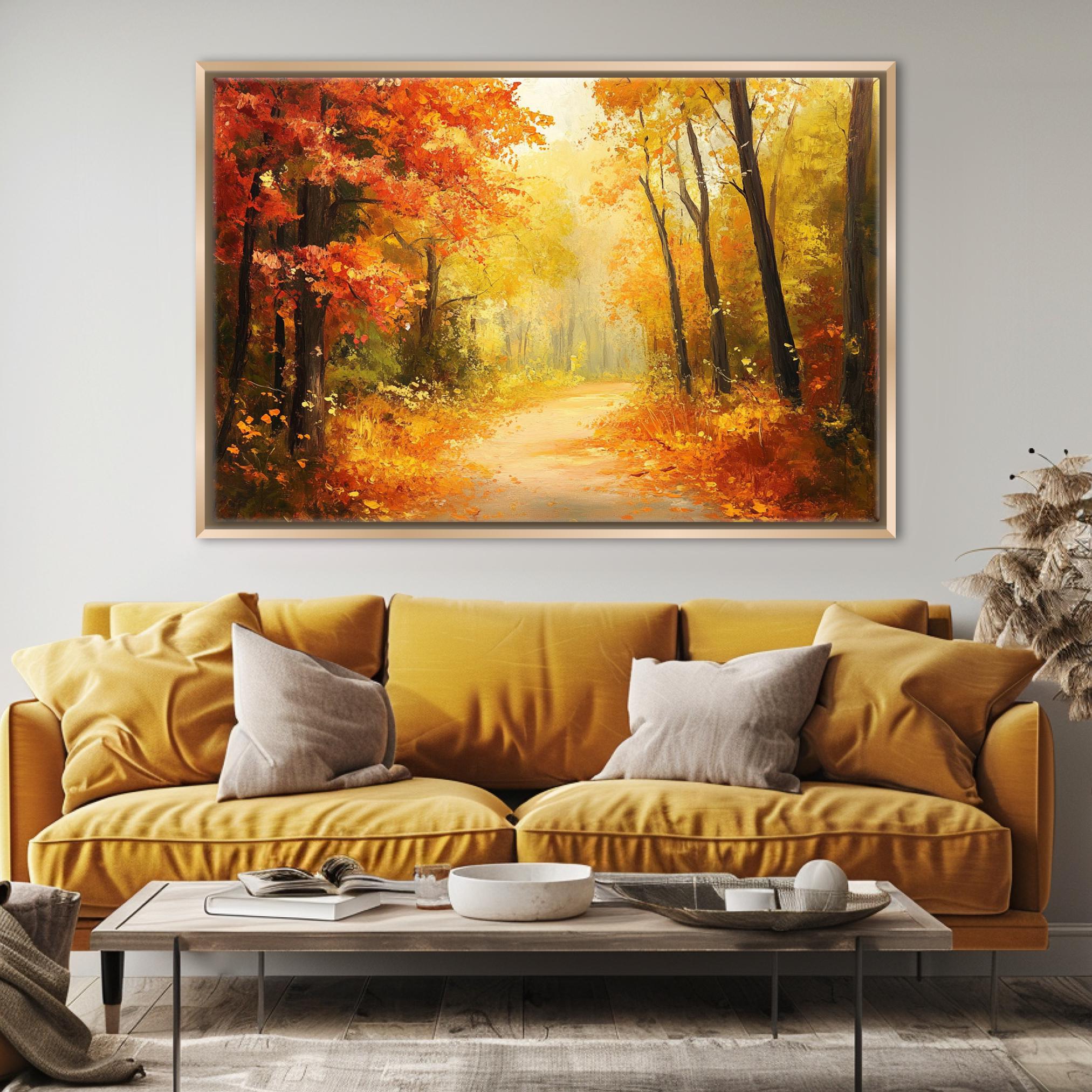a cozy living room with a large, vibrant painting of a forest path in autumn hanging on the wall above a yellow sofa. The painting is framed in gold and is the focal point of the room. The sofa is adorned with two throw pillows, and a coffee table is placed in front of it. The overall atmosphere of the room is warm and inviting, with the painting adding a touch of nature and color to the space.