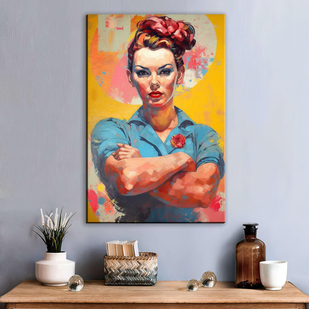 a vibrant painting of a woman with a determined expression, wearing a blue shirt and a red flower in her hair. The painting is hung on a wall above a wooden table, which has various decorative items such as a vase, a bottle, and a cup.