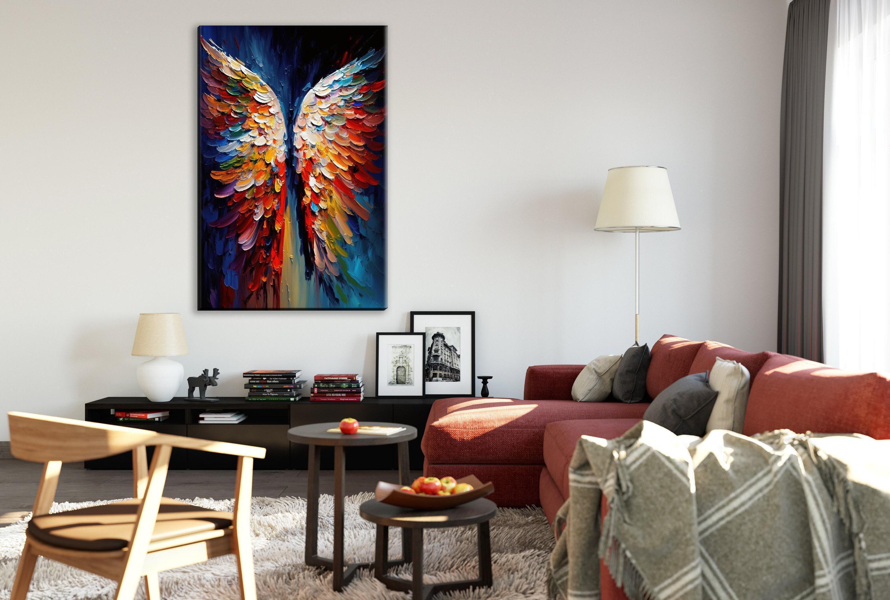 a modern living room with a large, colorful painting of a butterfly with outstretched wings as the focal point. The room is furnished with a red sofa, a wooden chair, and a coffee table with a bowl of fruit. The walls are painted white, and there are several framed pictures and a lamp on display.