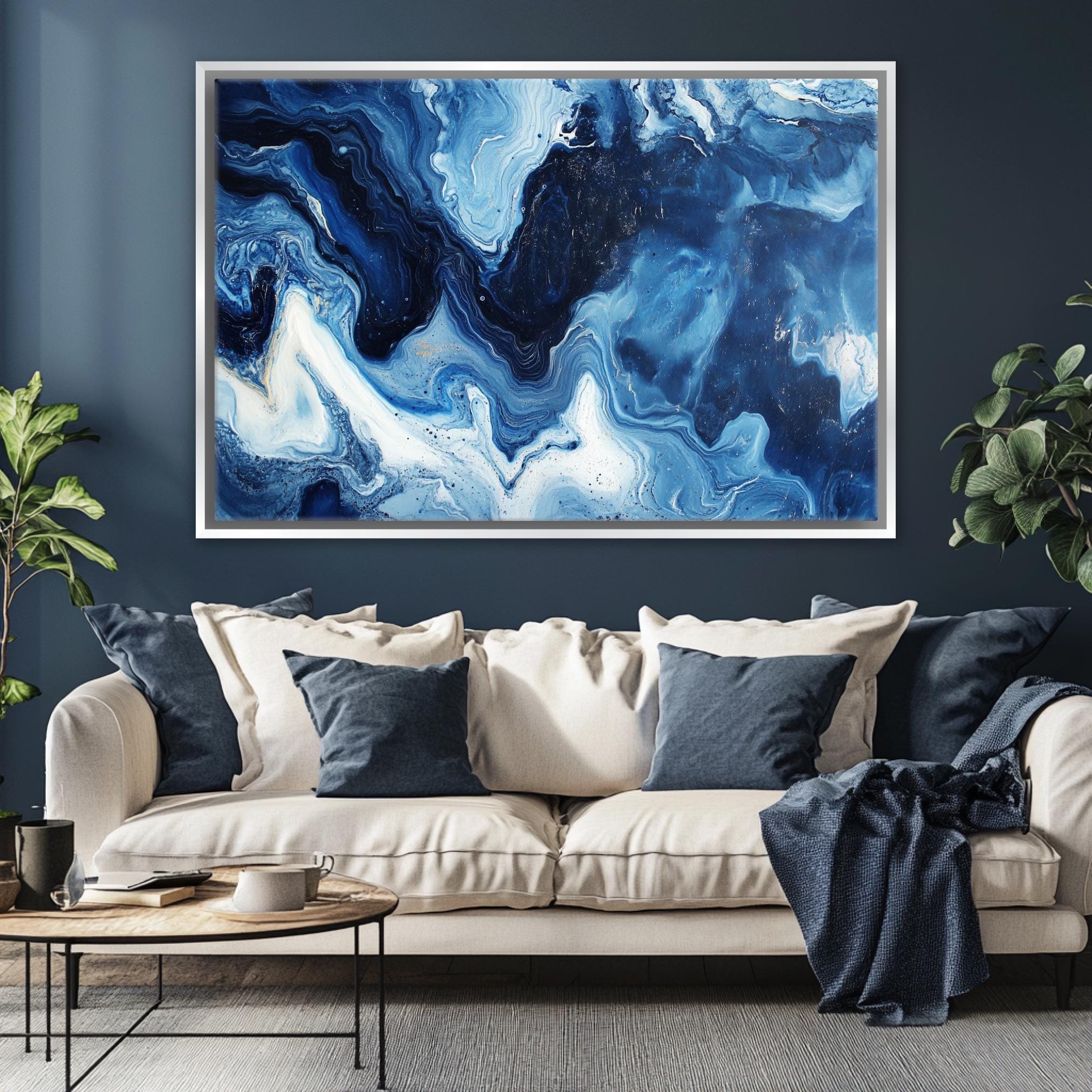 a living room with a couch and a painting on the wall