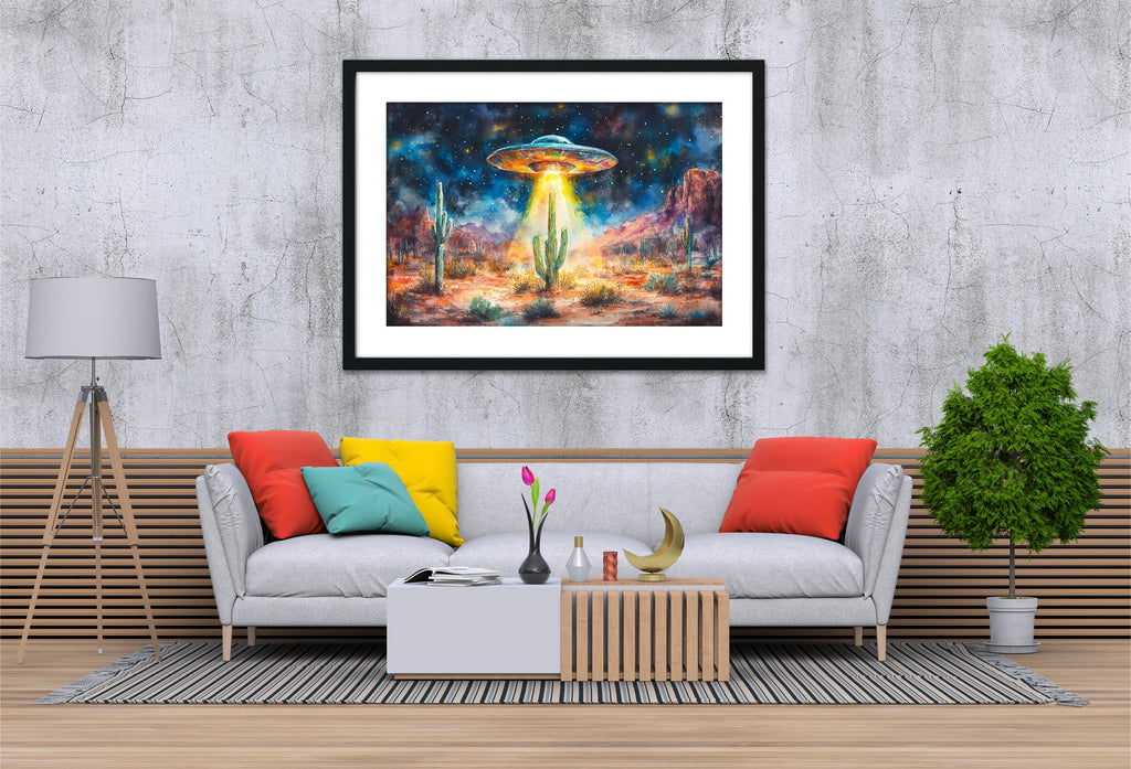 a living room with a gray sofa, a coffee table, and a framed painting of a desert landscape with an alien spacecraft hovering above it.